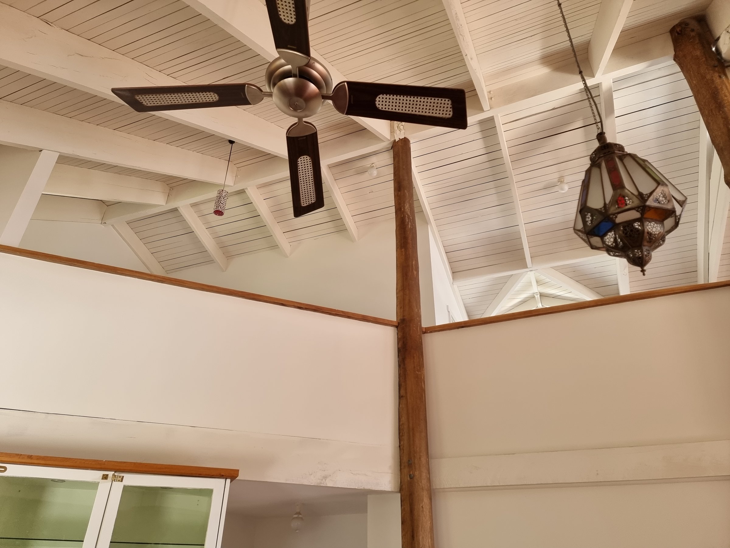 Quality Painting Group's family room transformation showing warm earth tones