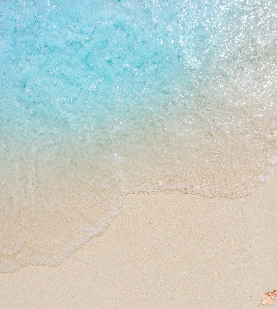 wave on sand beach, close up, top view