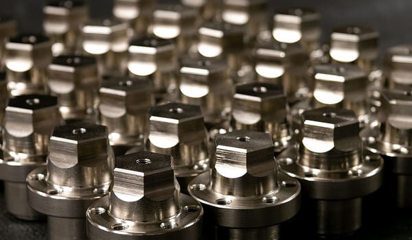 Chromium fragments, industrial use ore, metallic chemical element, isolated on black background inside a petri dish