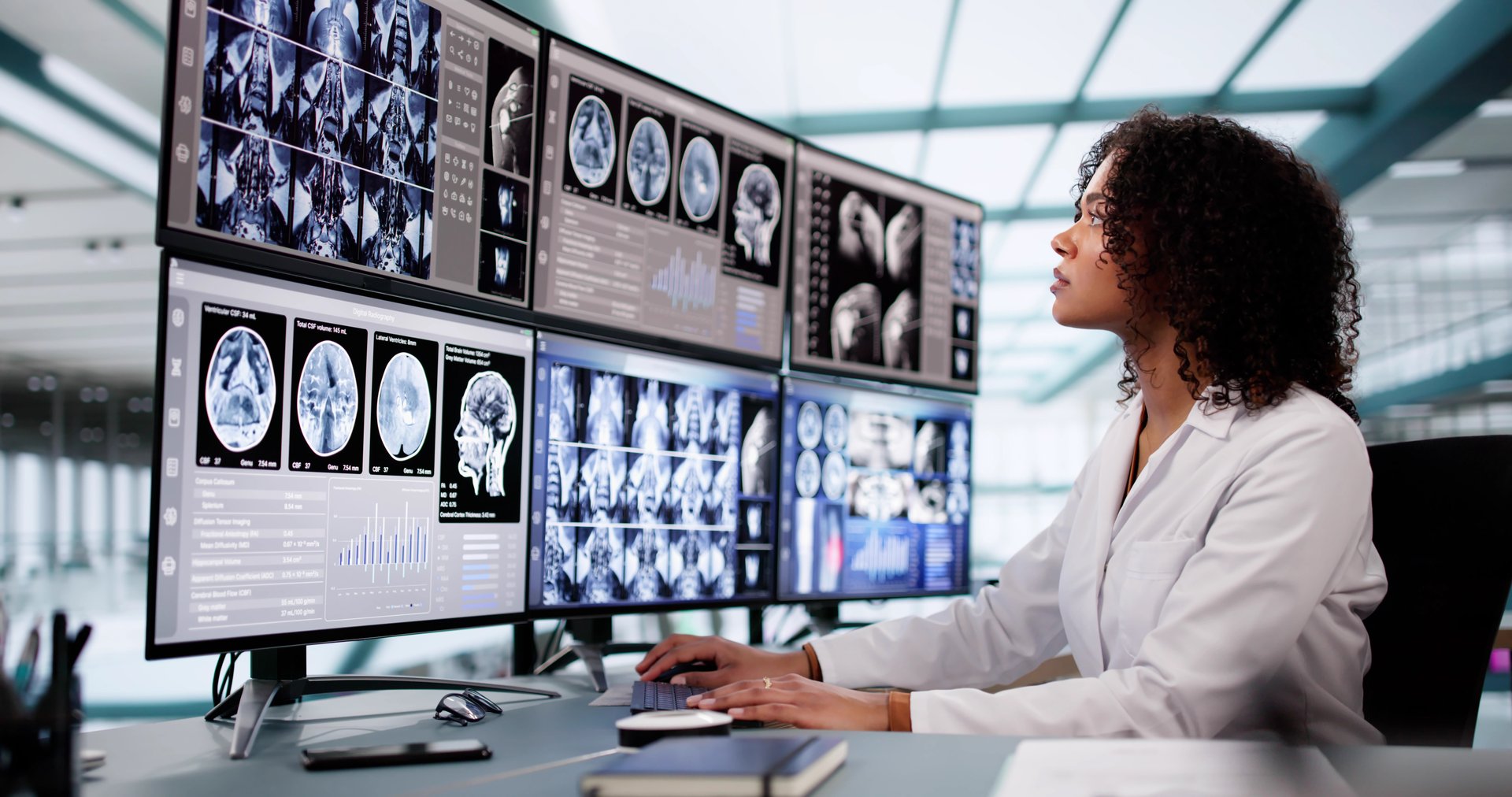 Doctor Looking At Xray Images Using Computer Software