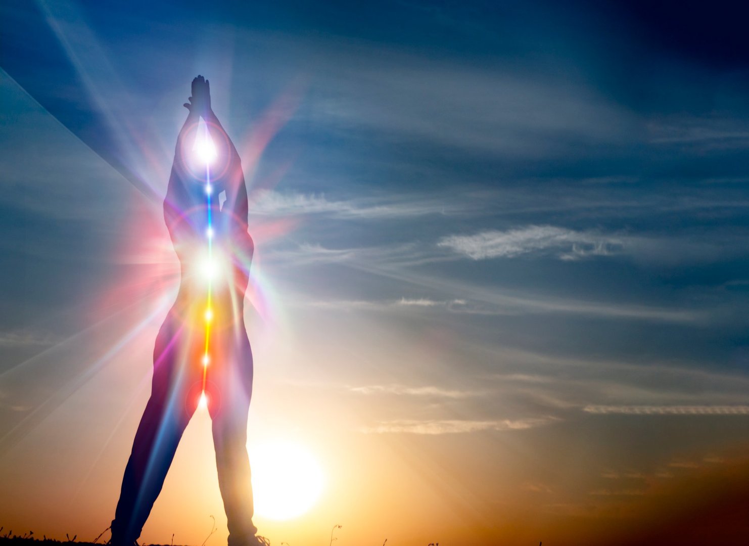woman in yoga pose on beach sunset view, glowing seven all chakra. Kundalini energy. girl practicing meditation outdoors. Silhouette.