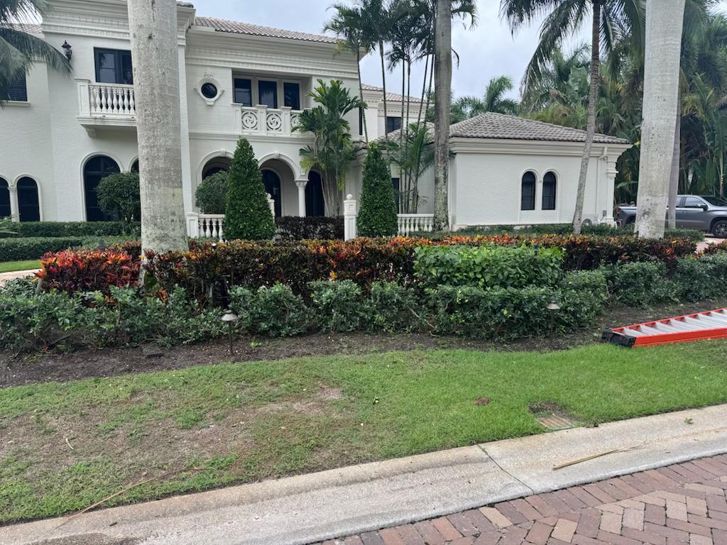 Immaculate lawn care and landscape maintenance showing perfectly manicured grass and garden beds