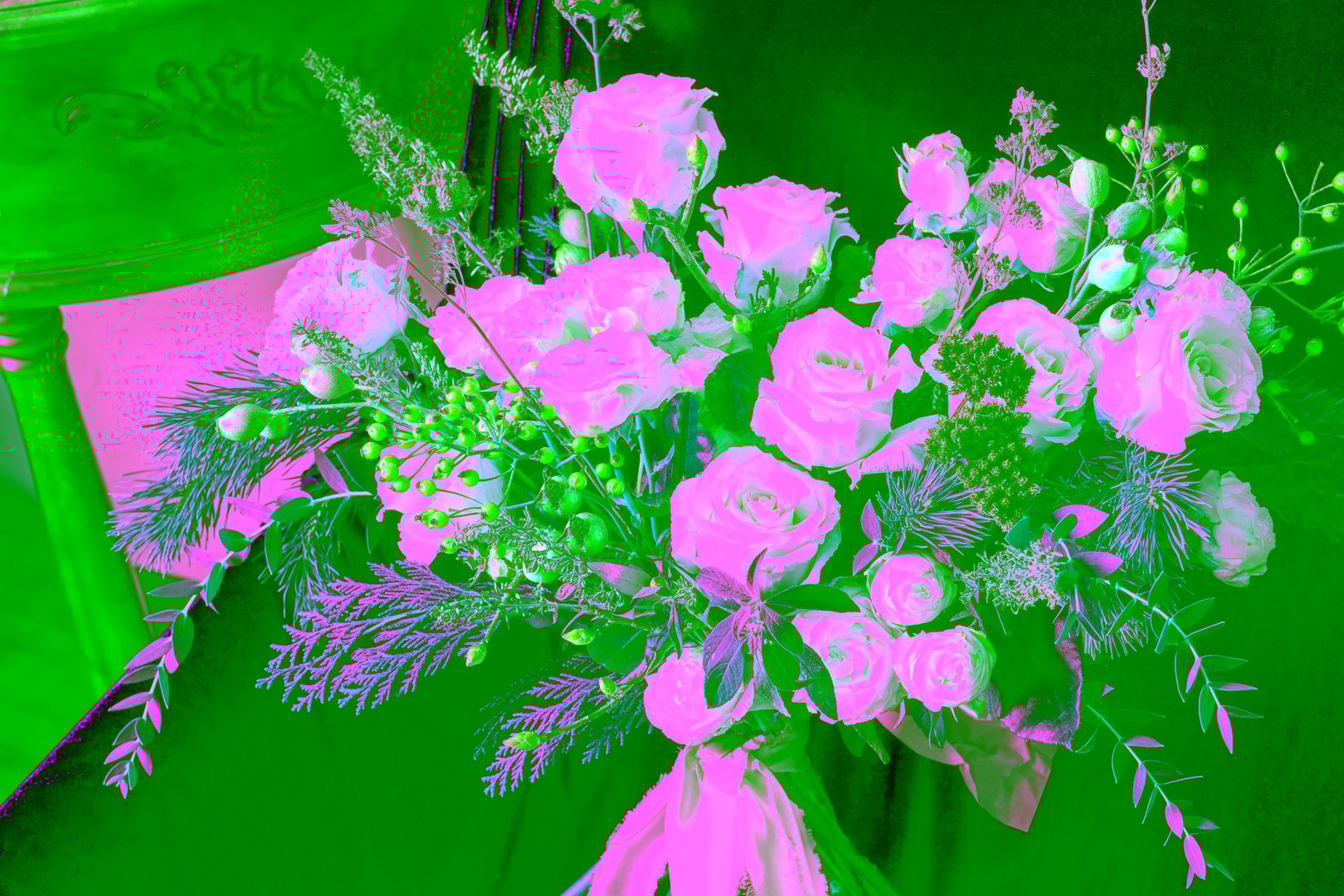 Winter wedding bouquet for the bride made of roses and evergreens