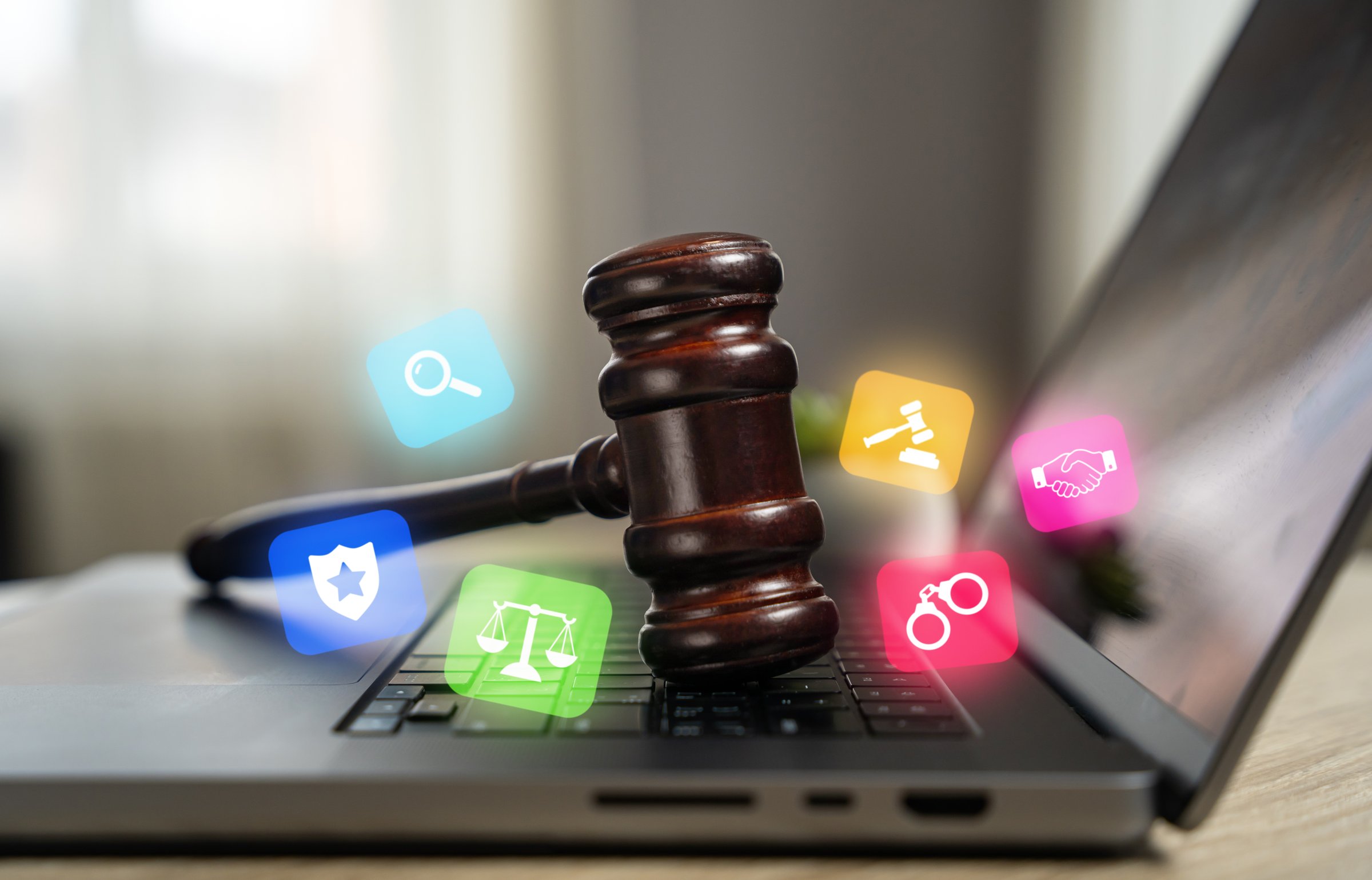 Judge's hammer on a laptop. Legal assistance. Legislative regulation of digital systems, cyberspace and Internet technologies. Data protection, online privacy, and internet legislation.
