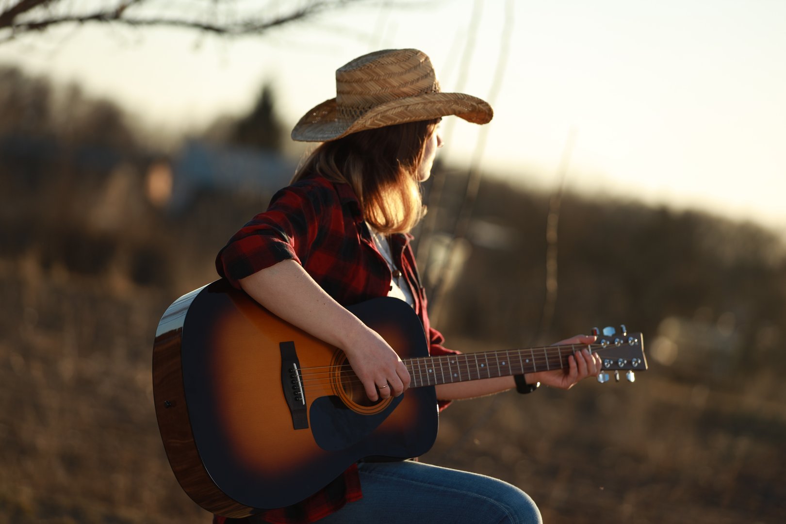 Raquel Cowgirl - Cowgirl with guitar at sunset