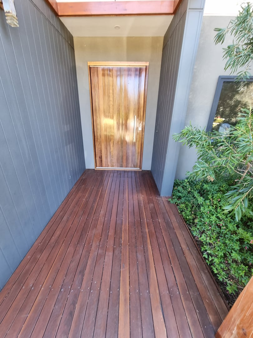 Quality Painting Group deck refinishing project before - weathered outdoor deck condition from February 2024 project