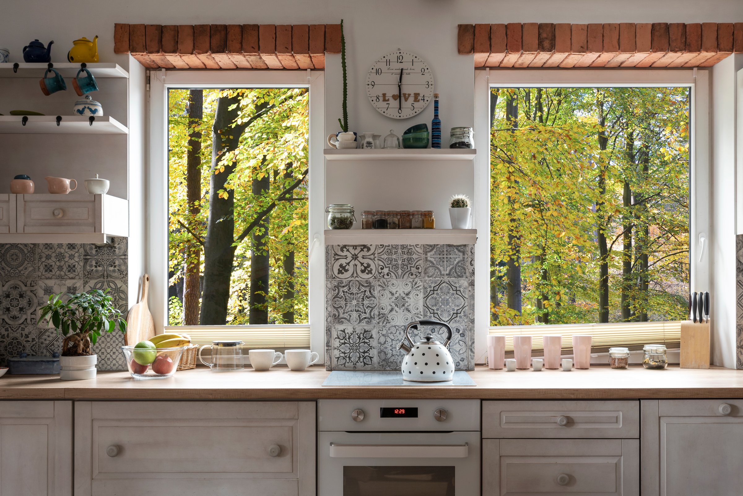 Modern kitchen with forest view and integrated water purifier