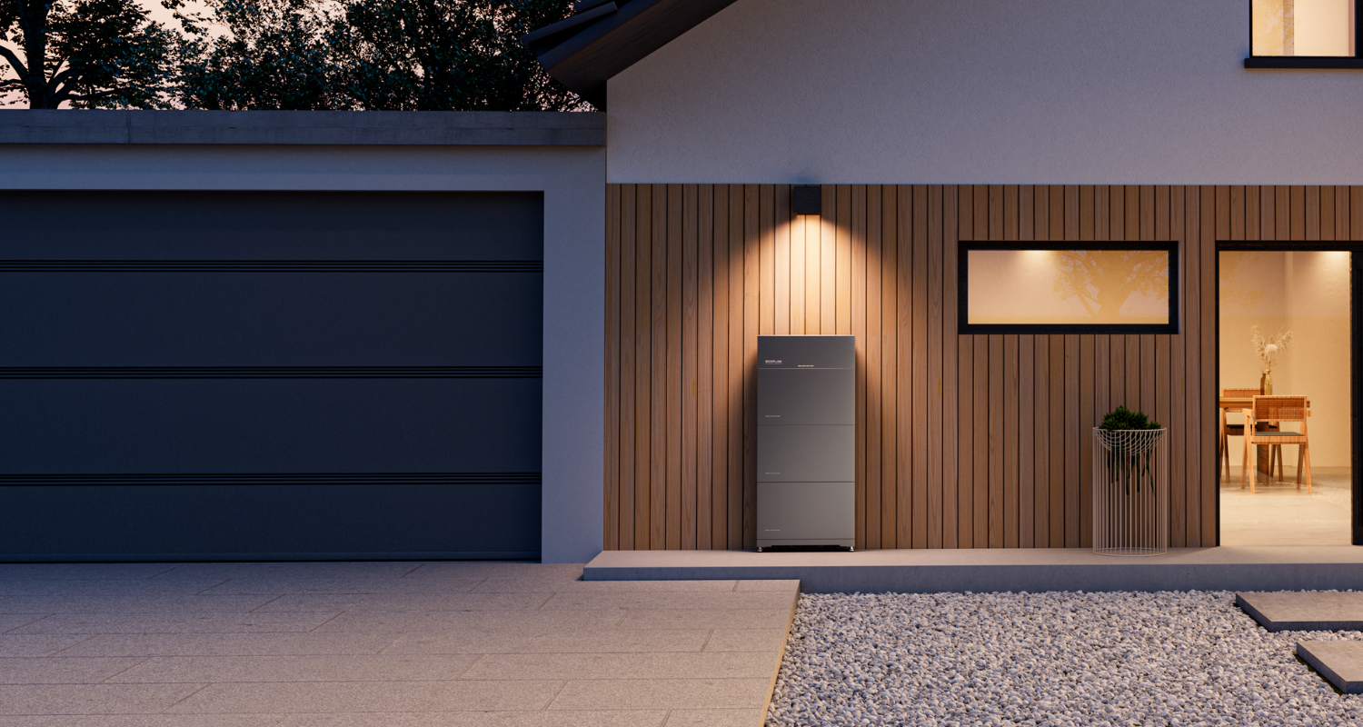 Modern house exterior with wood paneling, a gray garage, a garden planter, and a sleek outdoor appliance by the wall.