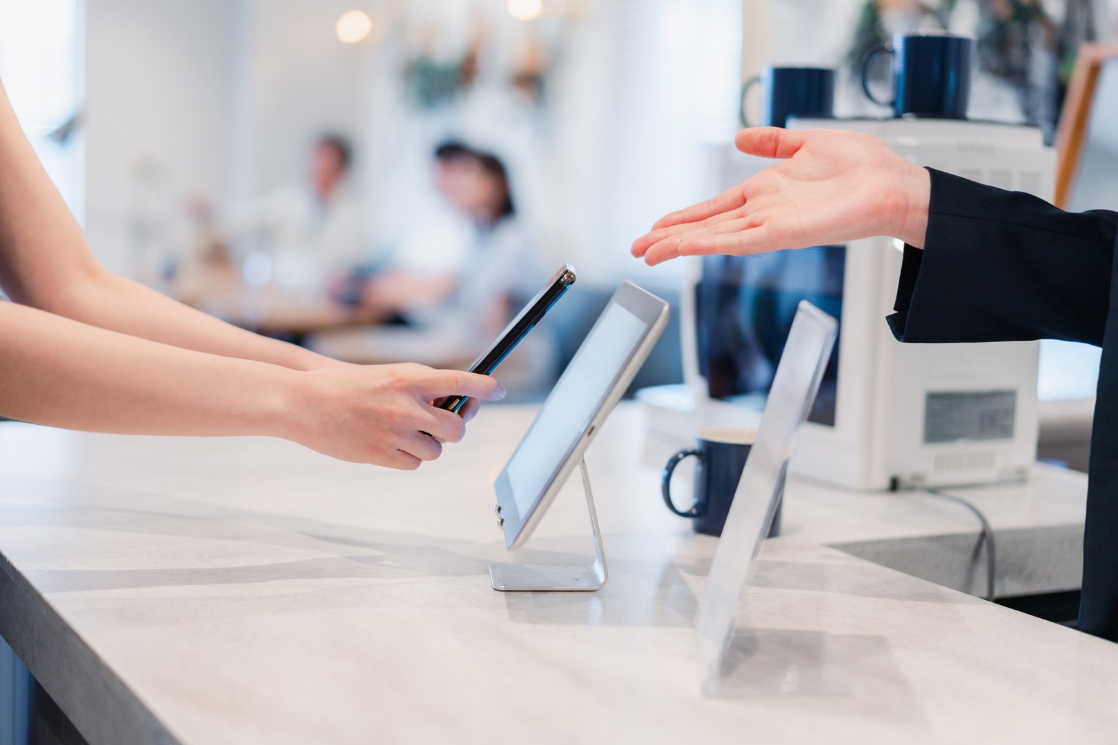 Young woman making a payment on her smartphone