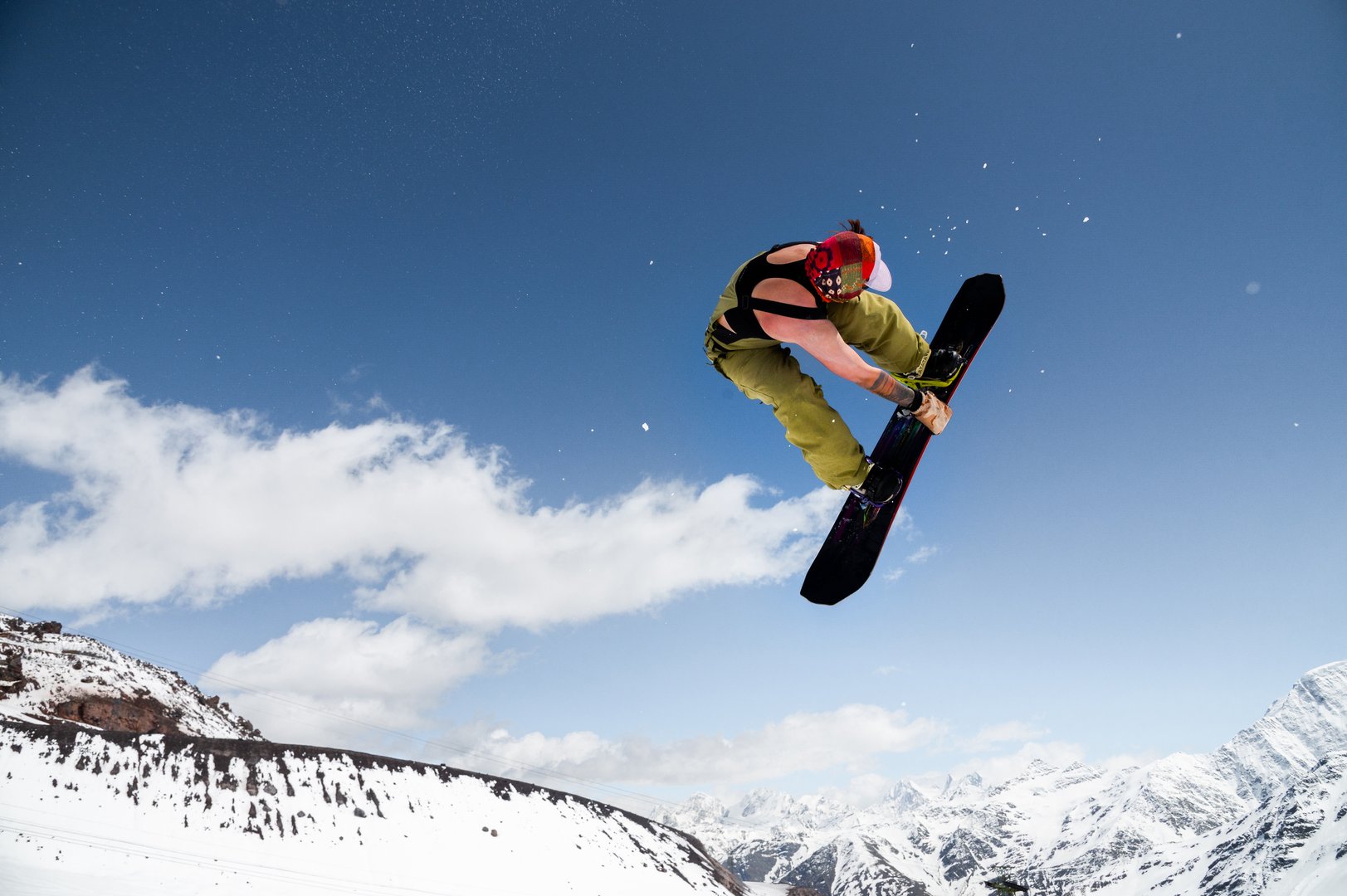 Beginner Snowboarder Riding On Sunny Day, Performing Trick In Air. Sport Tourist Snapshot While