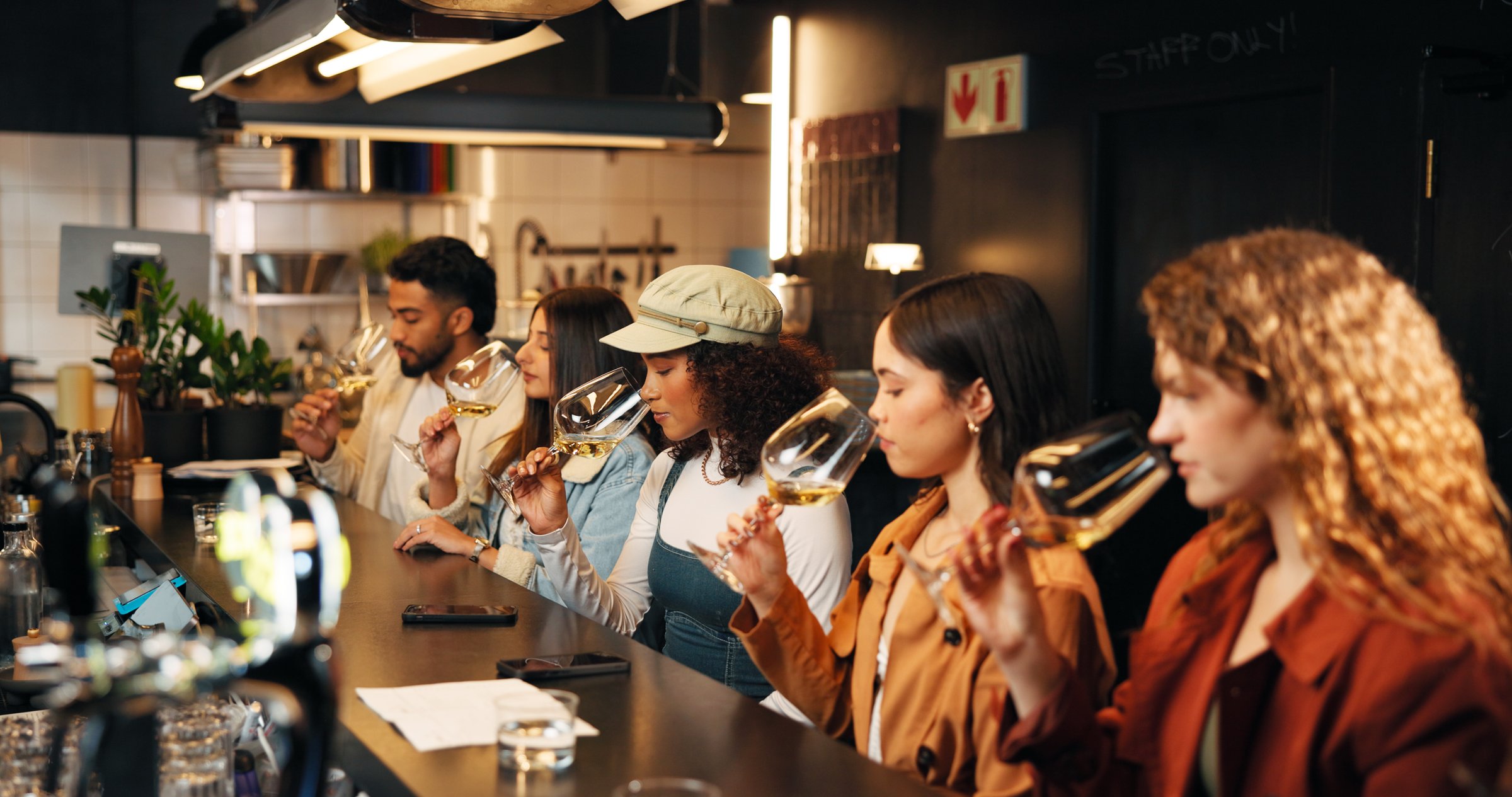 Restaurant, friends and smell glass at wine tasting for experience, flavor preparation and bonding.