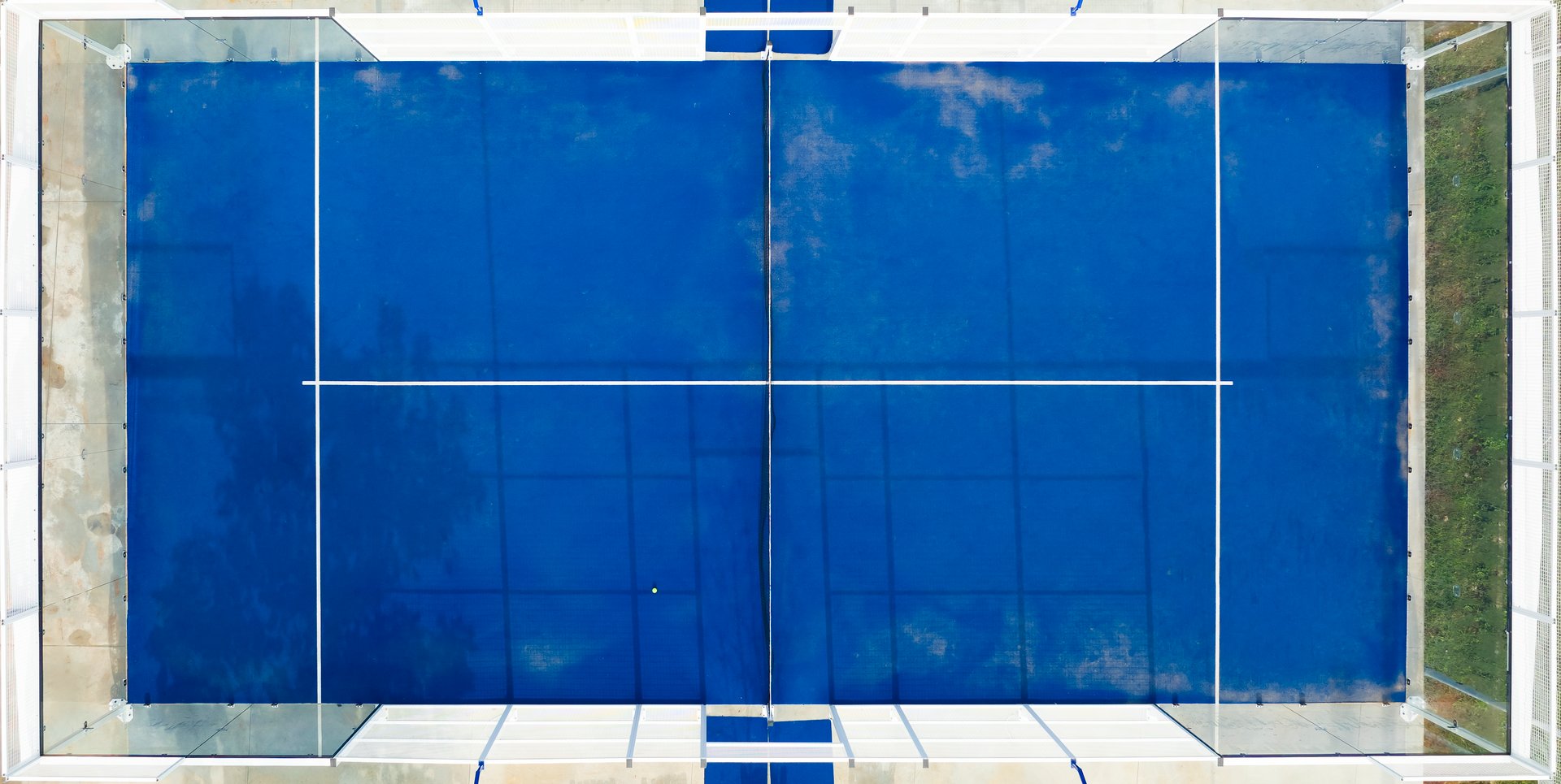 View from above, stunning aerial view of a blue padel court
