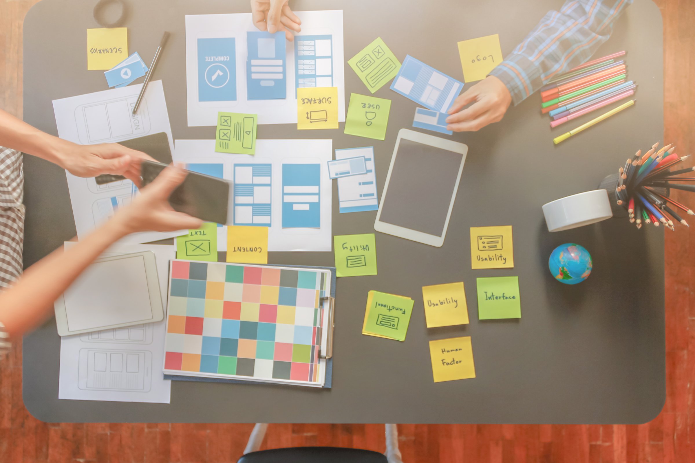 Smooth Focus, group of web designers are working together to develop mobile responsive website with UI UX Front End Designer Previewing. website designers in form of mobile applications with UI UX
