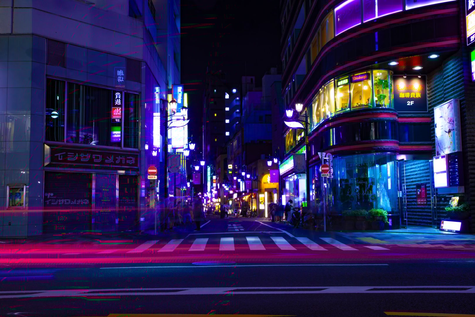 A night cityscape at the neon town in Shinjuku. High quality photo. Shinjuku district Shinjuku Tokyo Japan 09.05.2024 It is center of the city in Tokyo. Translation on neonboard text the name of shop.
