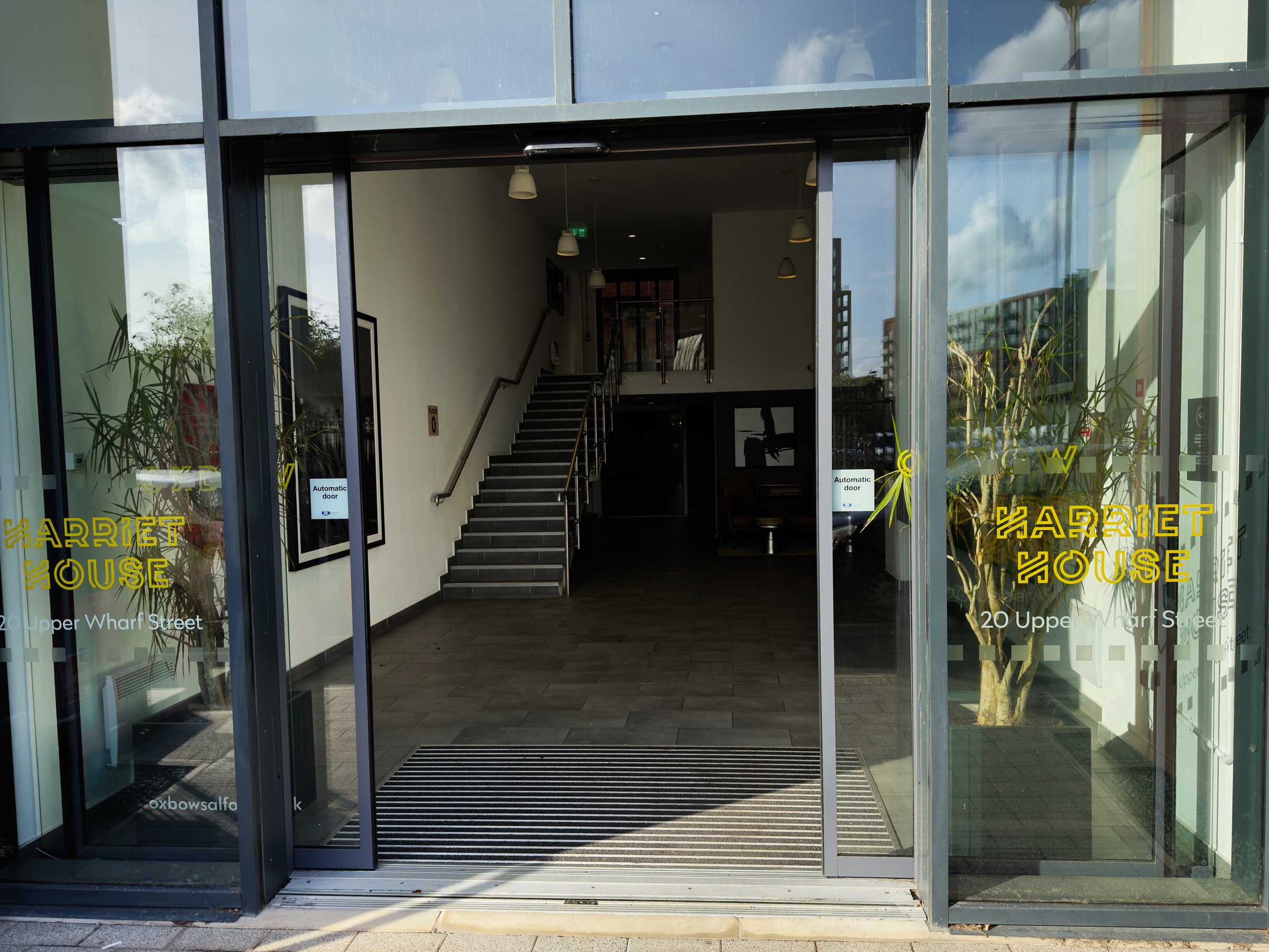 Salford, UK - September 16, 2025: Open doors to Harriet House in Salford featuring stairs and welcoming ambiance