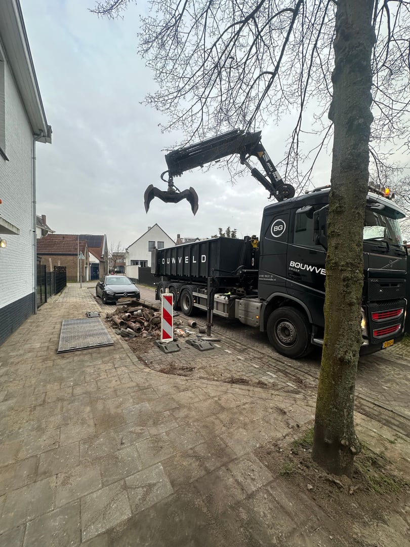 Autolaadkraan met afzetbak