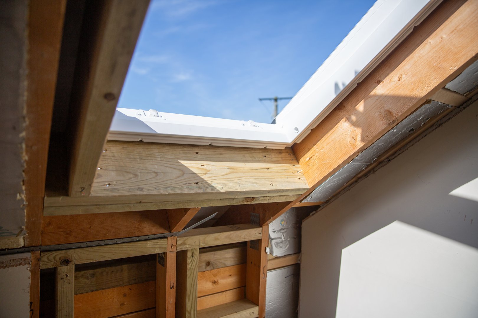 Two roof windows being installed in a residential property