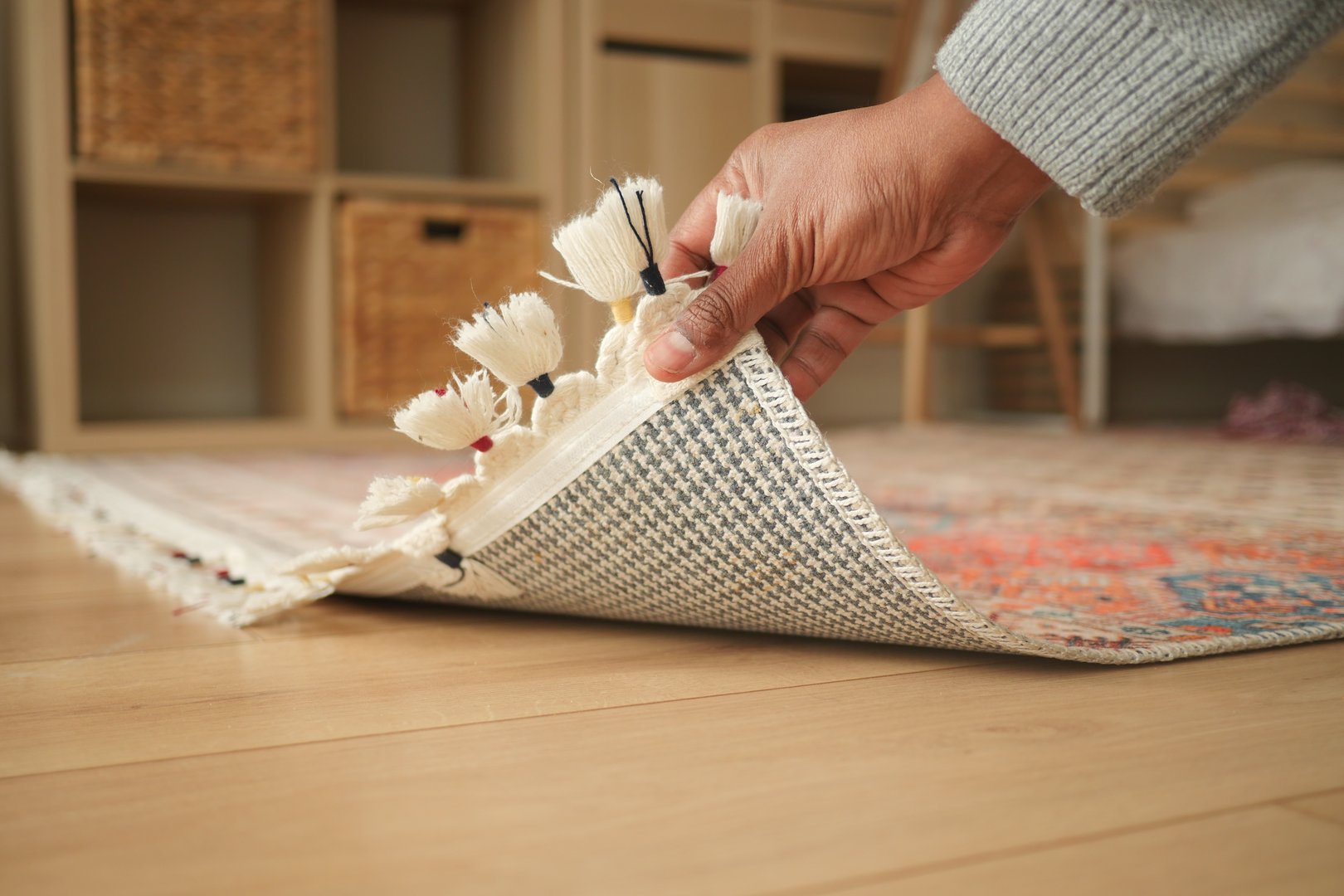 Hidden rug moth damage found underneath an area rug