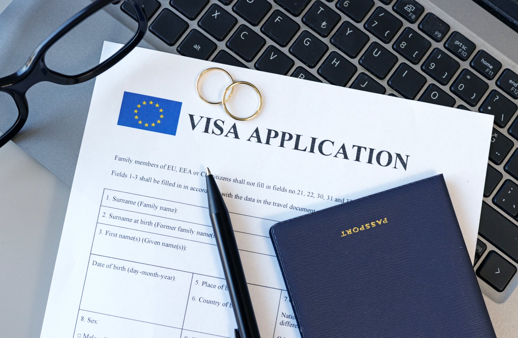Schengen Visa application form and passport for marriage. Application to register permanent residence. Immigration concept
