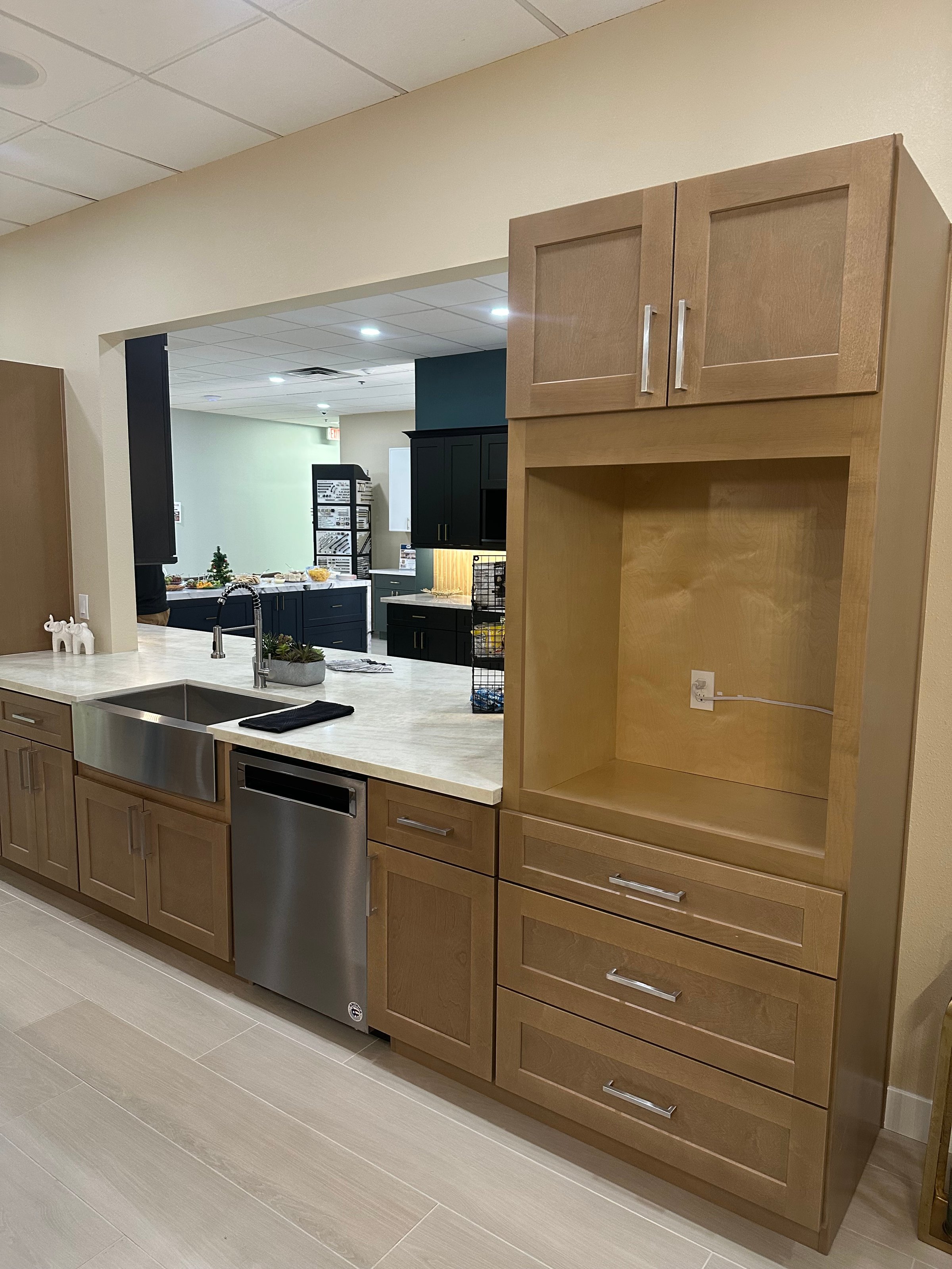 Modern kitchen with white Shaker cabinets and marble countertops
