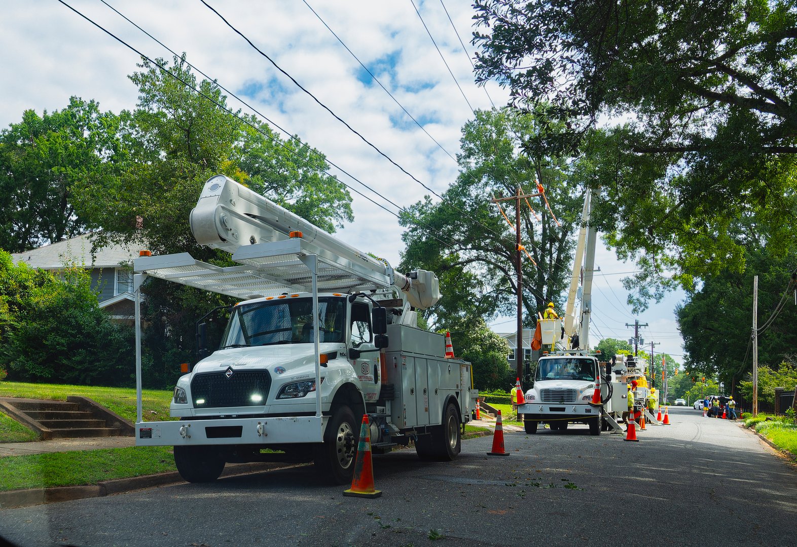 Utility trucks working on powerlines maintenance. Belmont, NC, USA  August 26 2024.