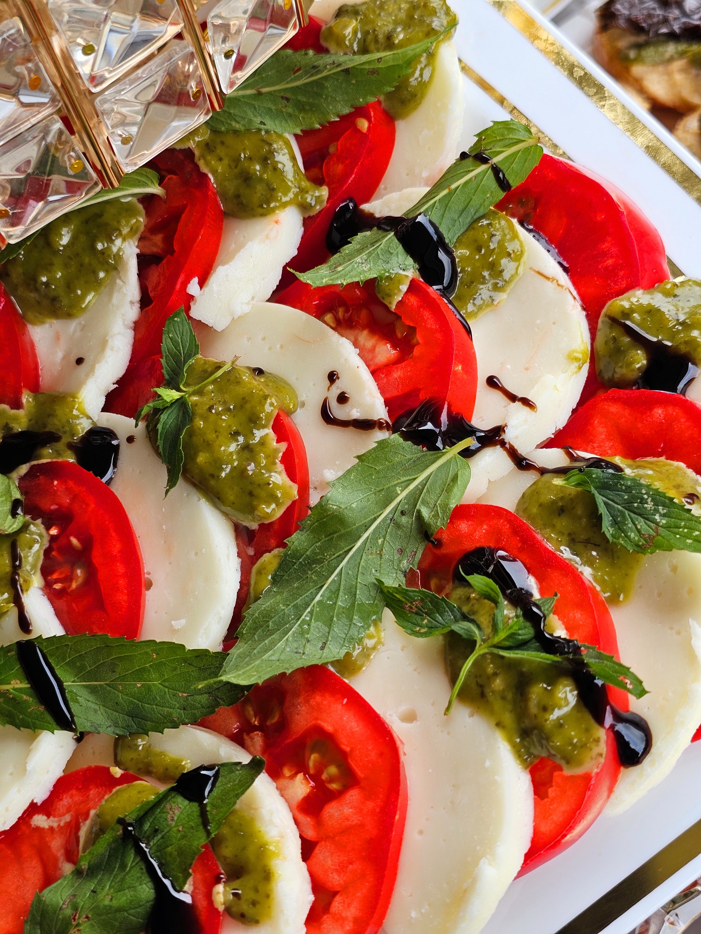Caprese Salad with Mozzarella, Tomatoes and Pesto