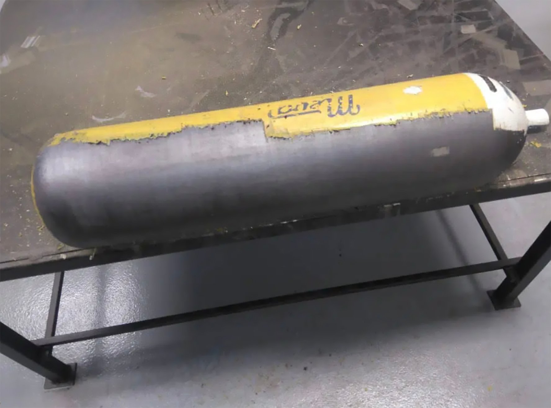 Close up scene rust cleaning process by portable laser cleaning machine. The rust removing on the pipe by laser cleaner machine.