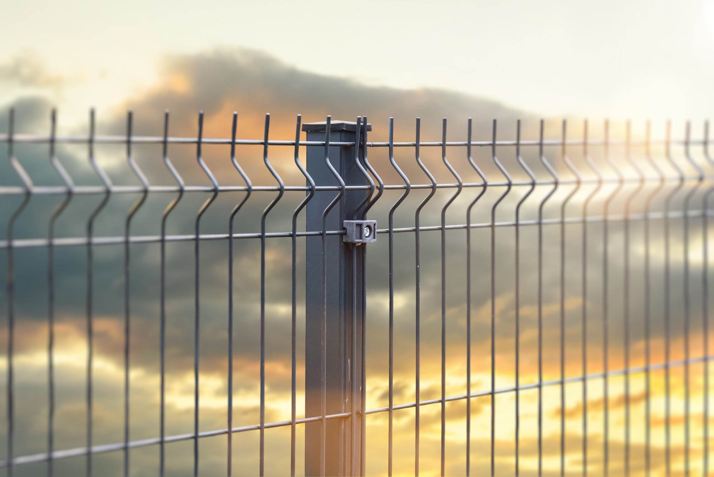 pvc metal fence panel and sunset sky