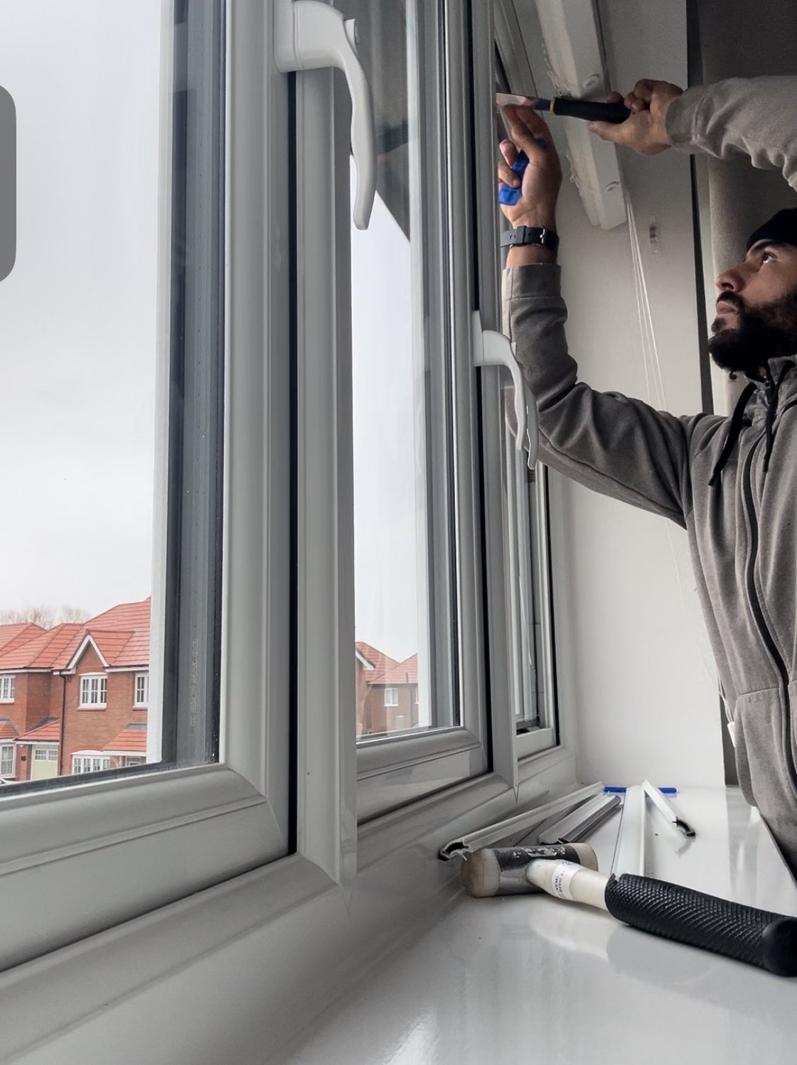 A man inspecting house window outside on day light
