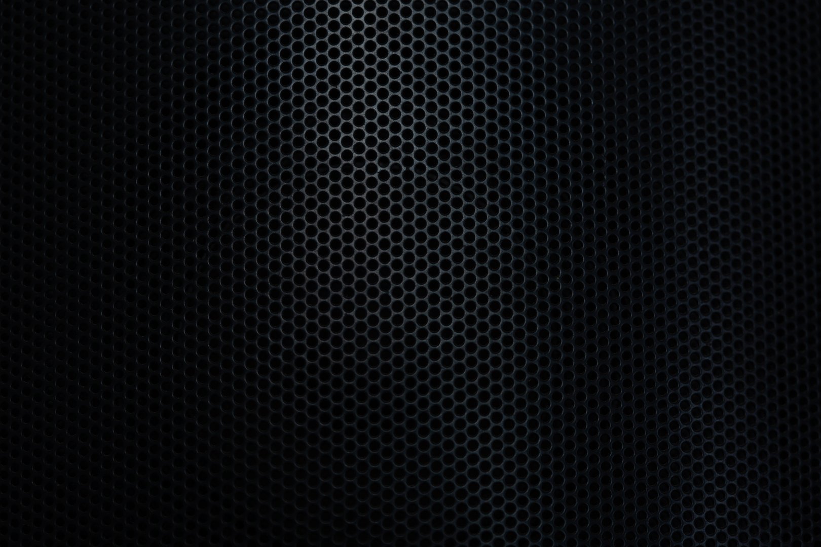 Black macro mesh background,Speaker grill texture,black macro texture,Speaker grille,Abstract black metallic mesh texture for background. Industrial backdrop. The speaker of a musical column. Panoramic horizontal high-resolution photography