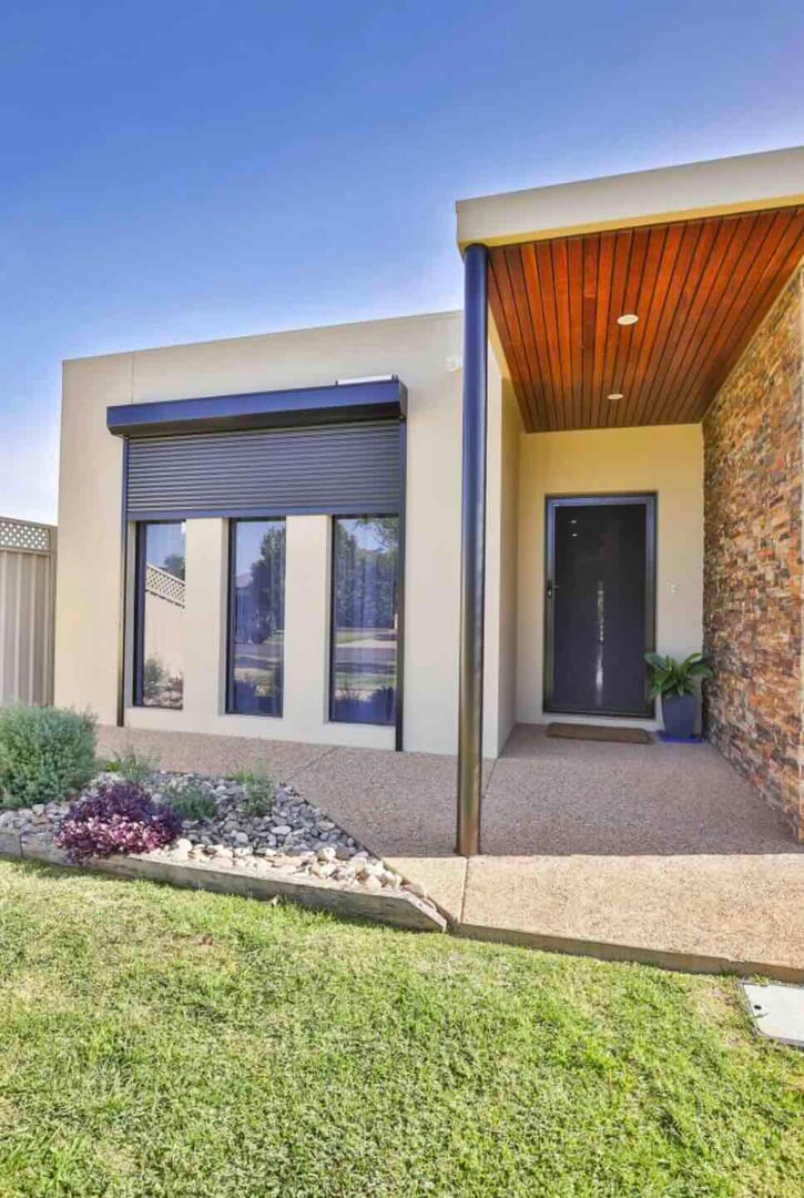 Partly opened bifold plantation shutters.