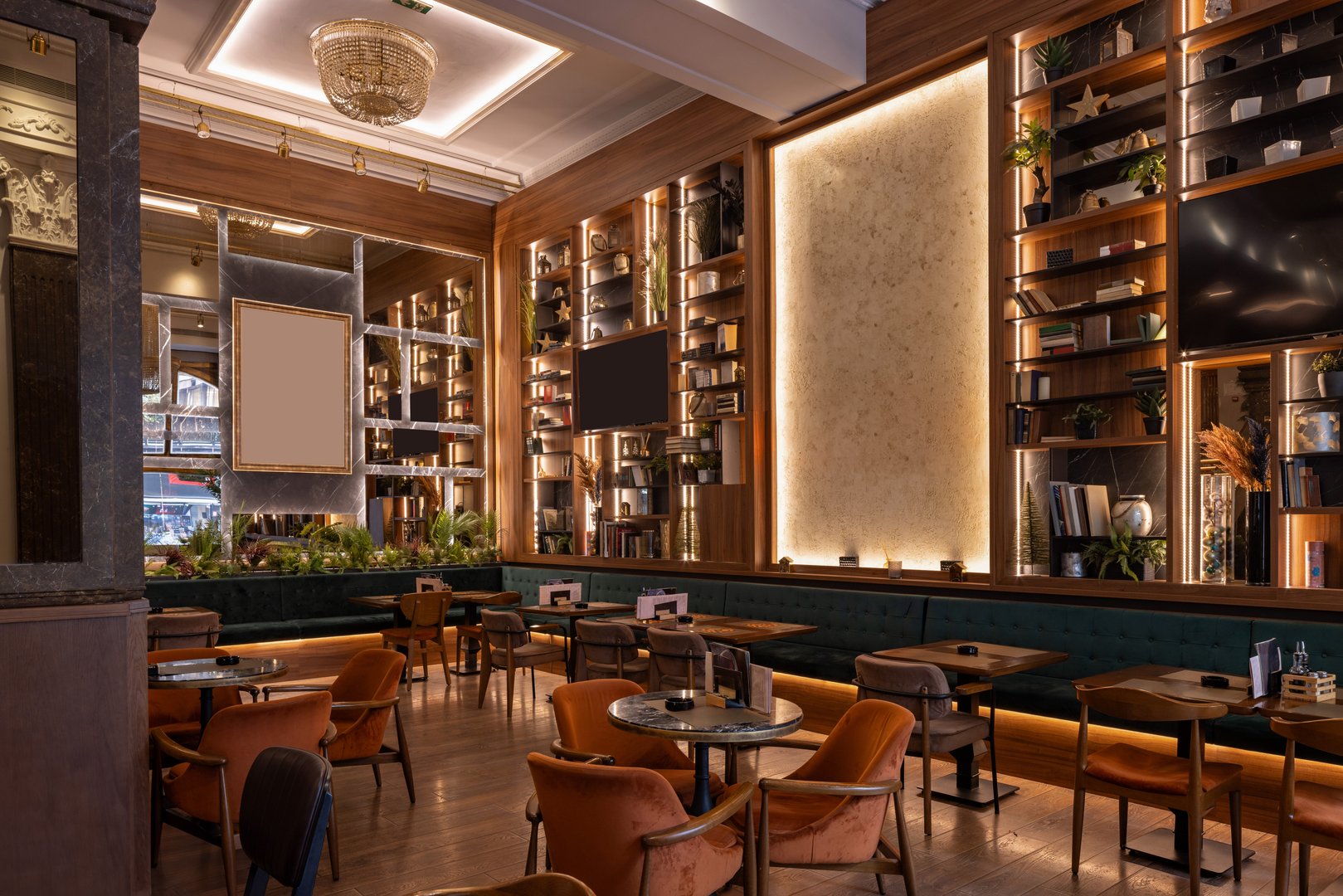 Stylish double-level restaurant featuring wooden décor, chandeliers, and warm ambient lighting