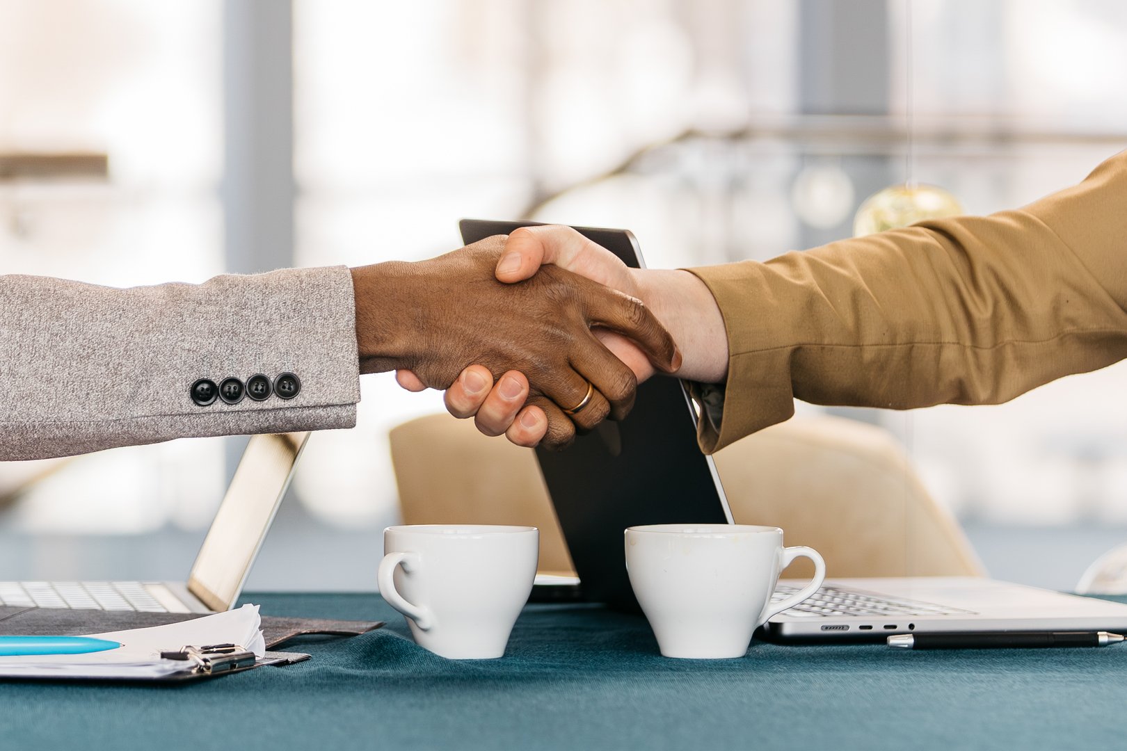 Businessmen shaking hands after a successful deal. The concept of trust, success and strong business relationships.