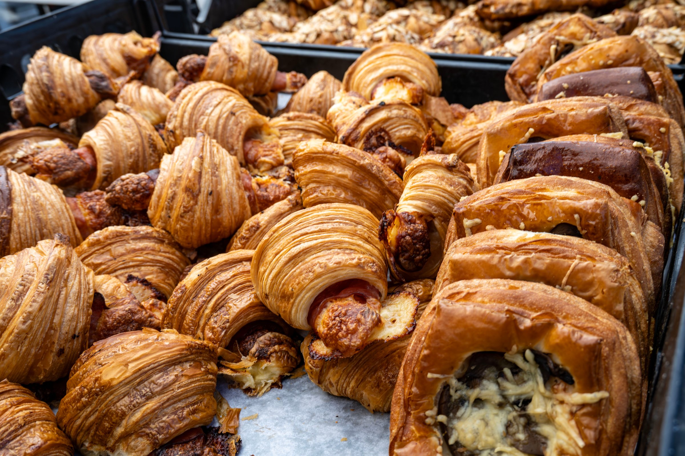 An assortment of fresh baked pastries at the local farmers market