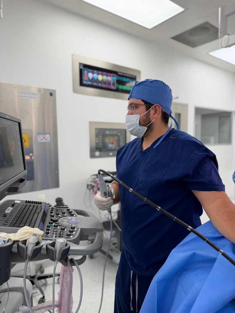 Senior man having medical exam. Elderly patient is having ultrasound examination of his heart by experienced doctor.