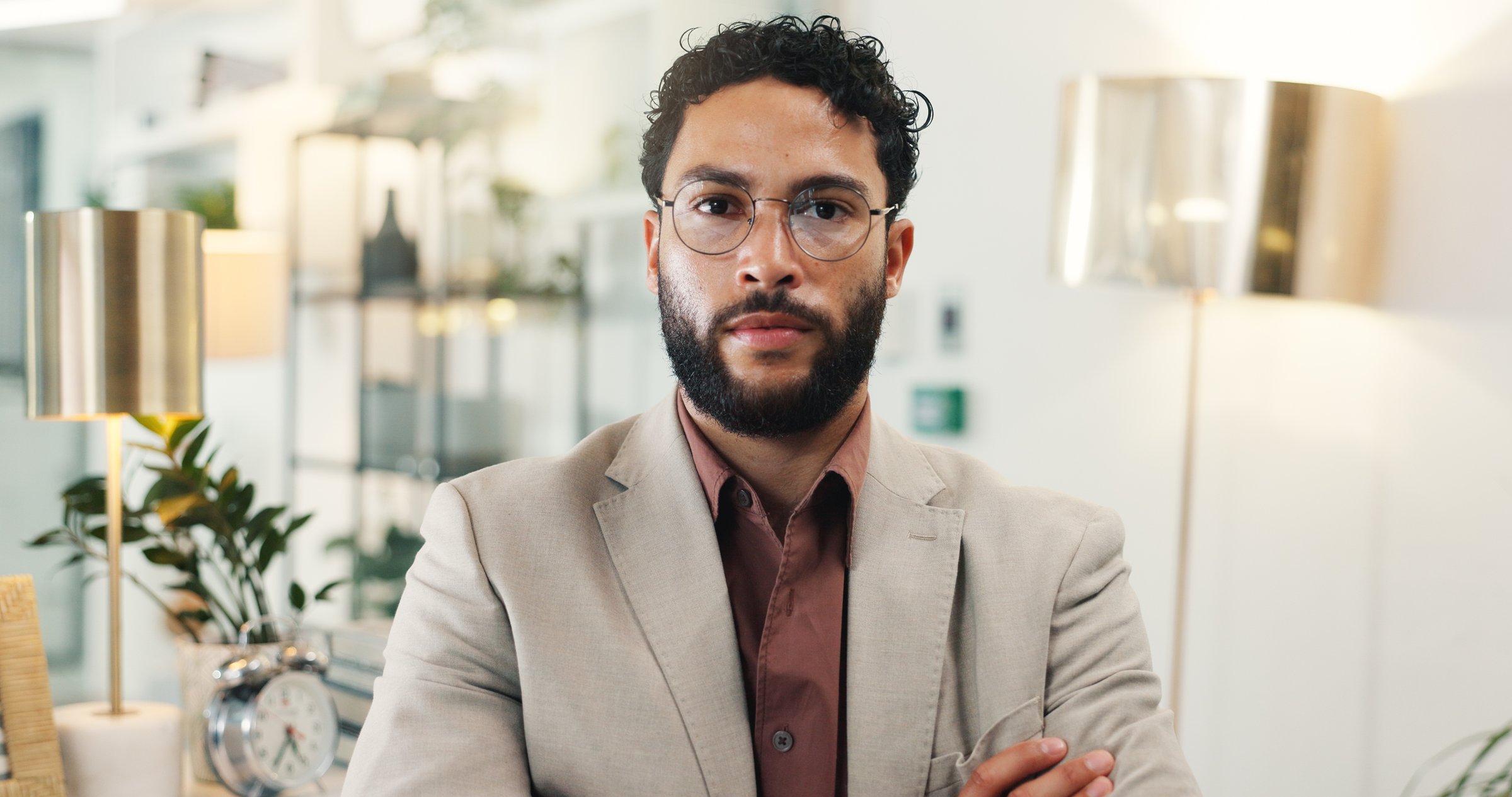 Serious, glasses and portrait of businessman in office with confidence for wealth management career. Pride, crossed arms and face of male financial manager in workplace with spectacles.