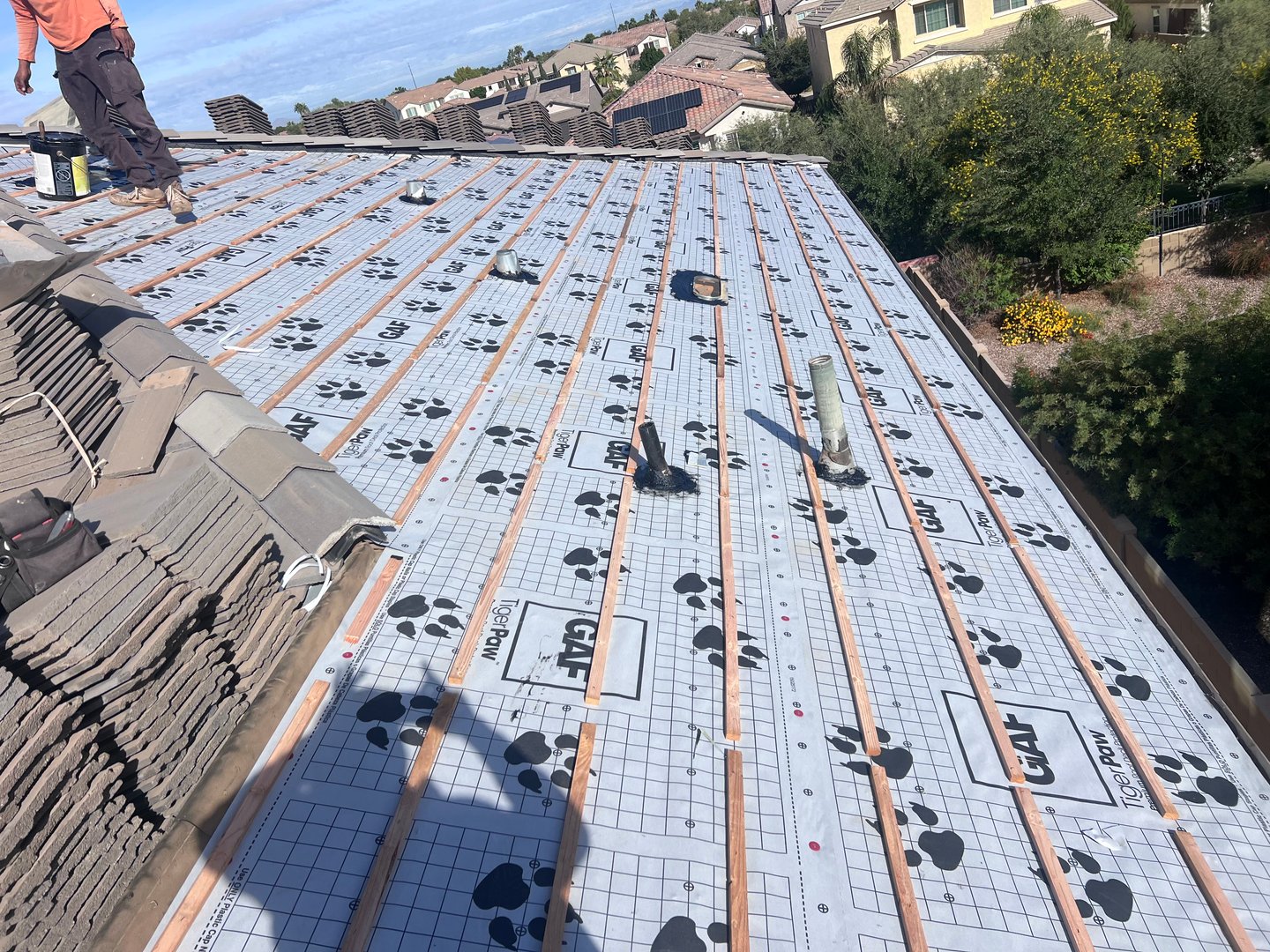 AZ Roofing Dudes team member working on roof repair