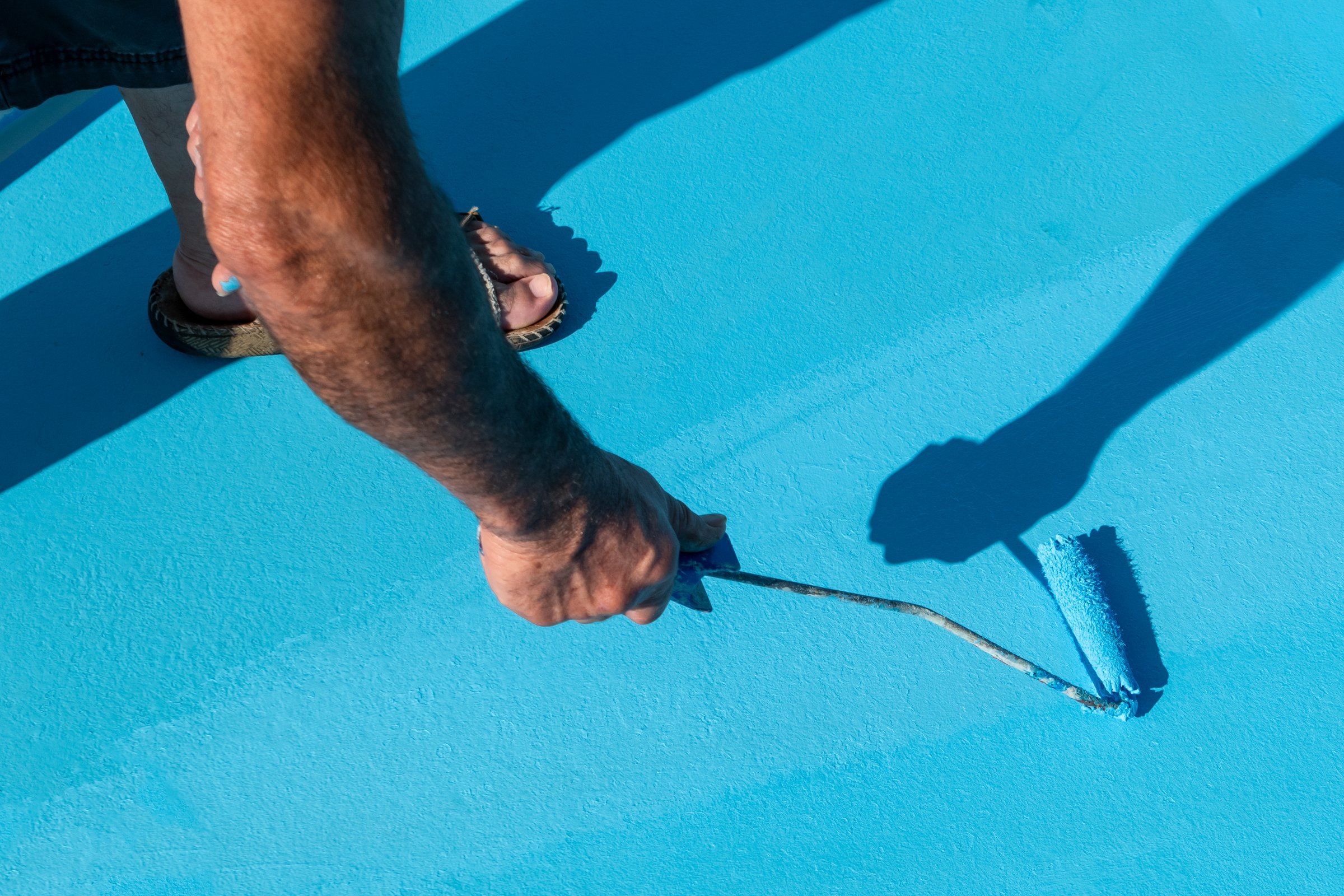 Painter's skill brings the pool floor and walls to life with a fresh coat