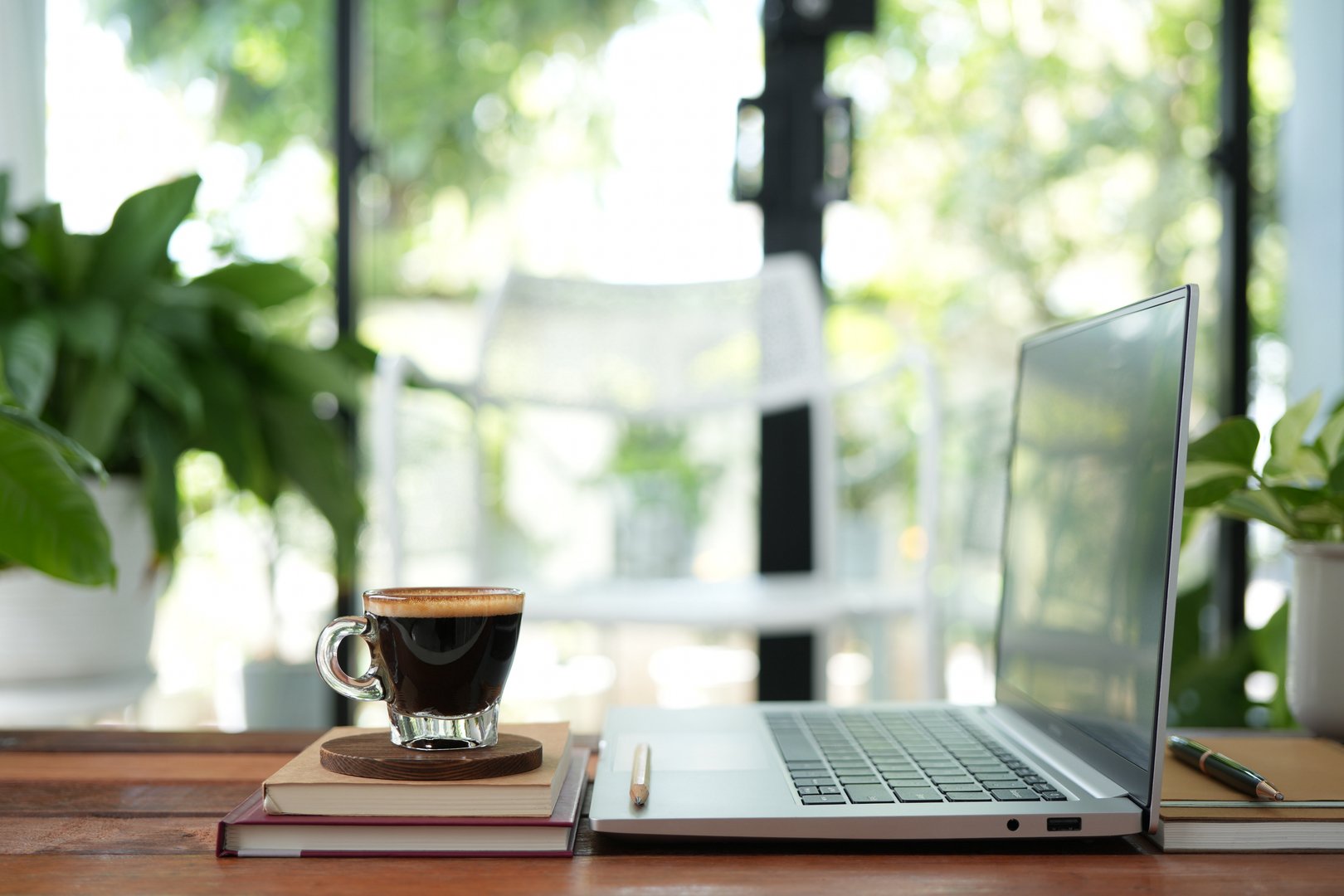 Coffee break and laptop on rustic wood table