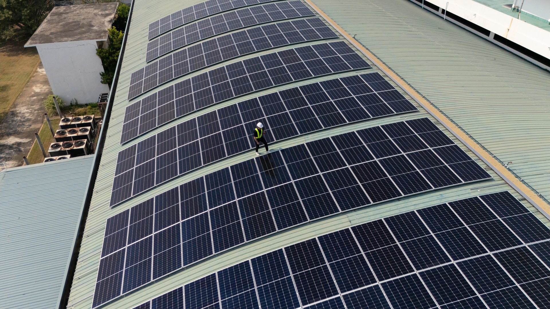 A team of engineers takes care of cleaning the solar panels outside the building. Installing solar cells on the roof Solar panels on the roof