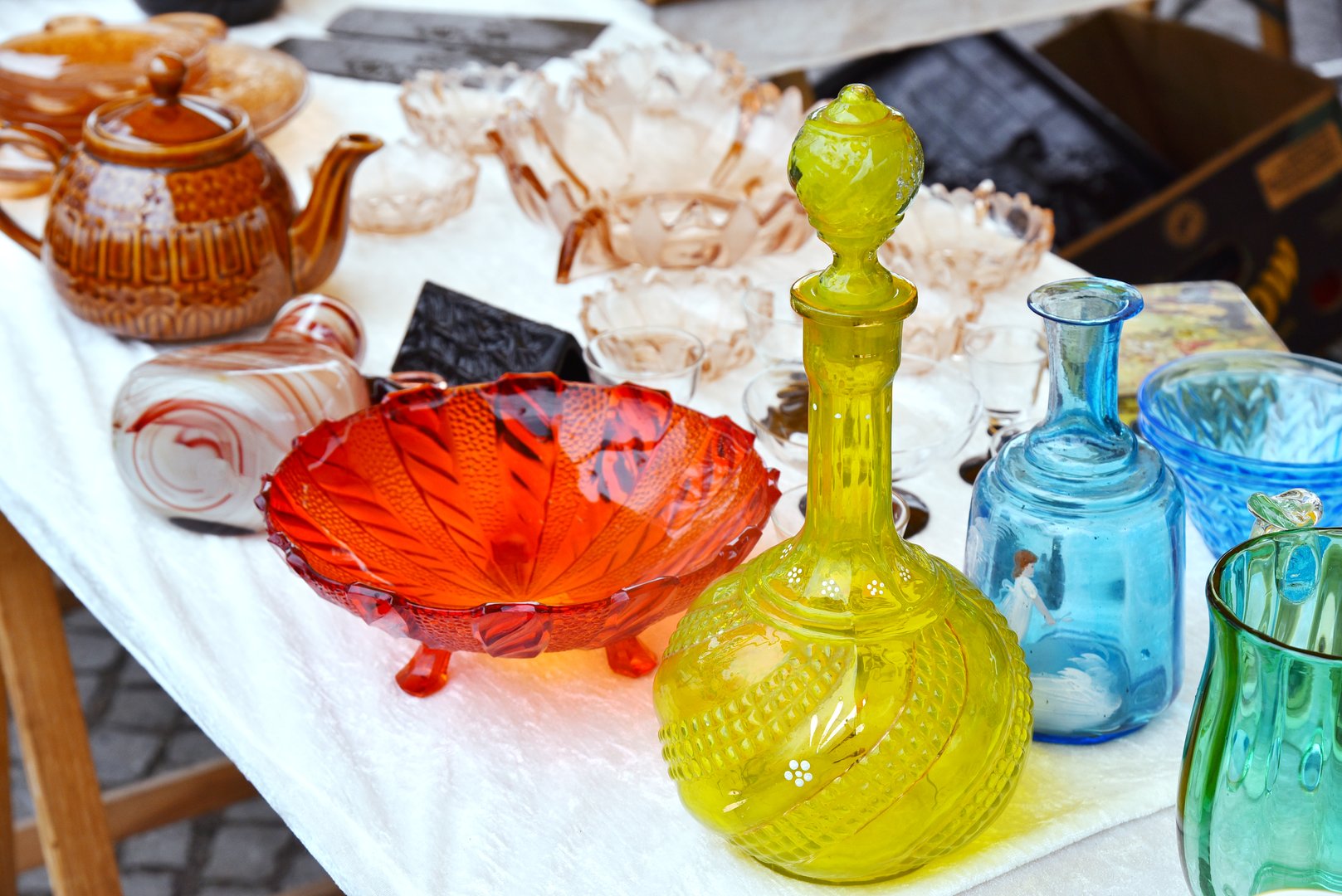 Set of glass decanter jug, glassware vase, fruit stand old vintage glassware garage sale on flea market.