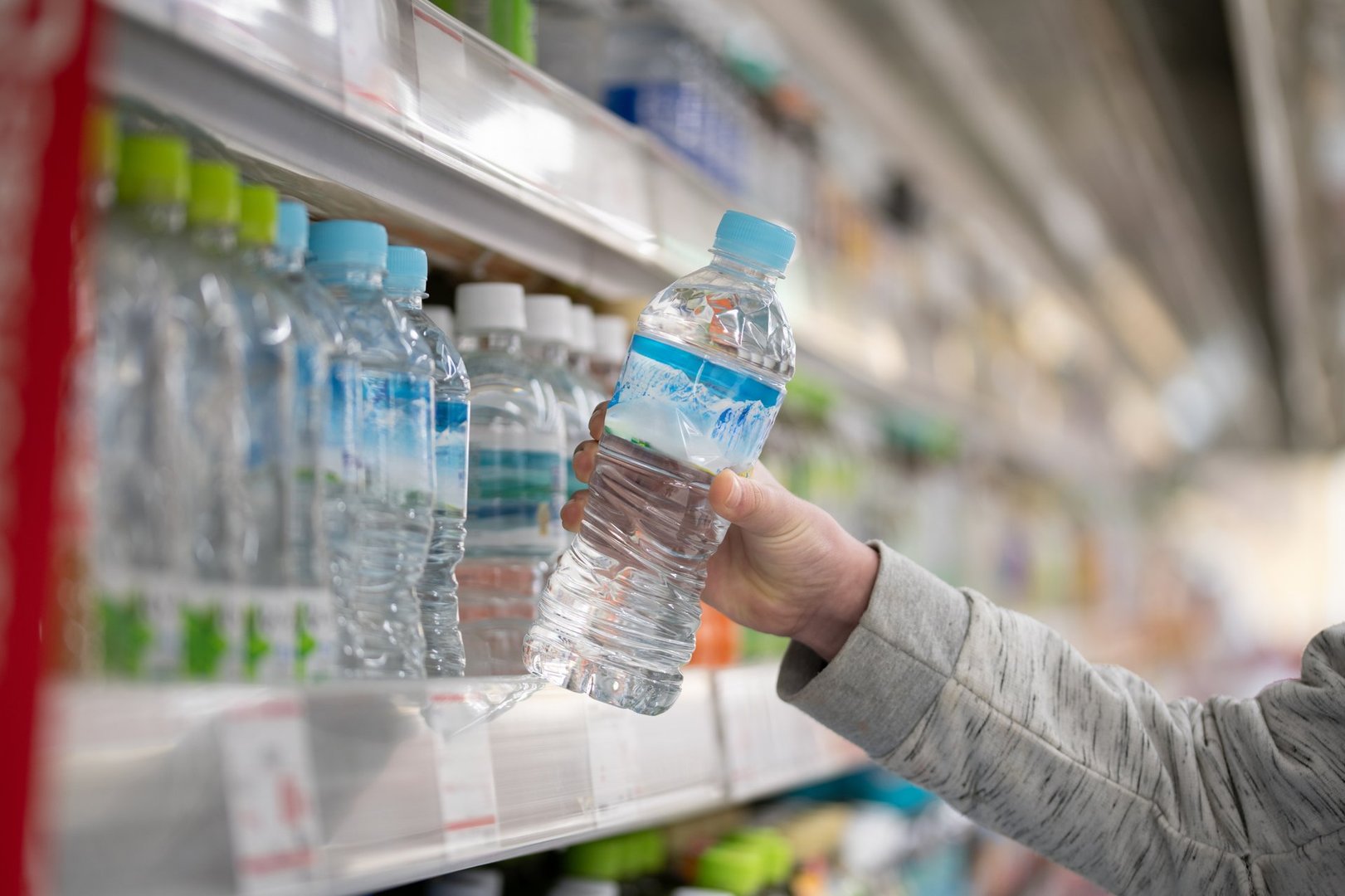 Shopper buying bottled water