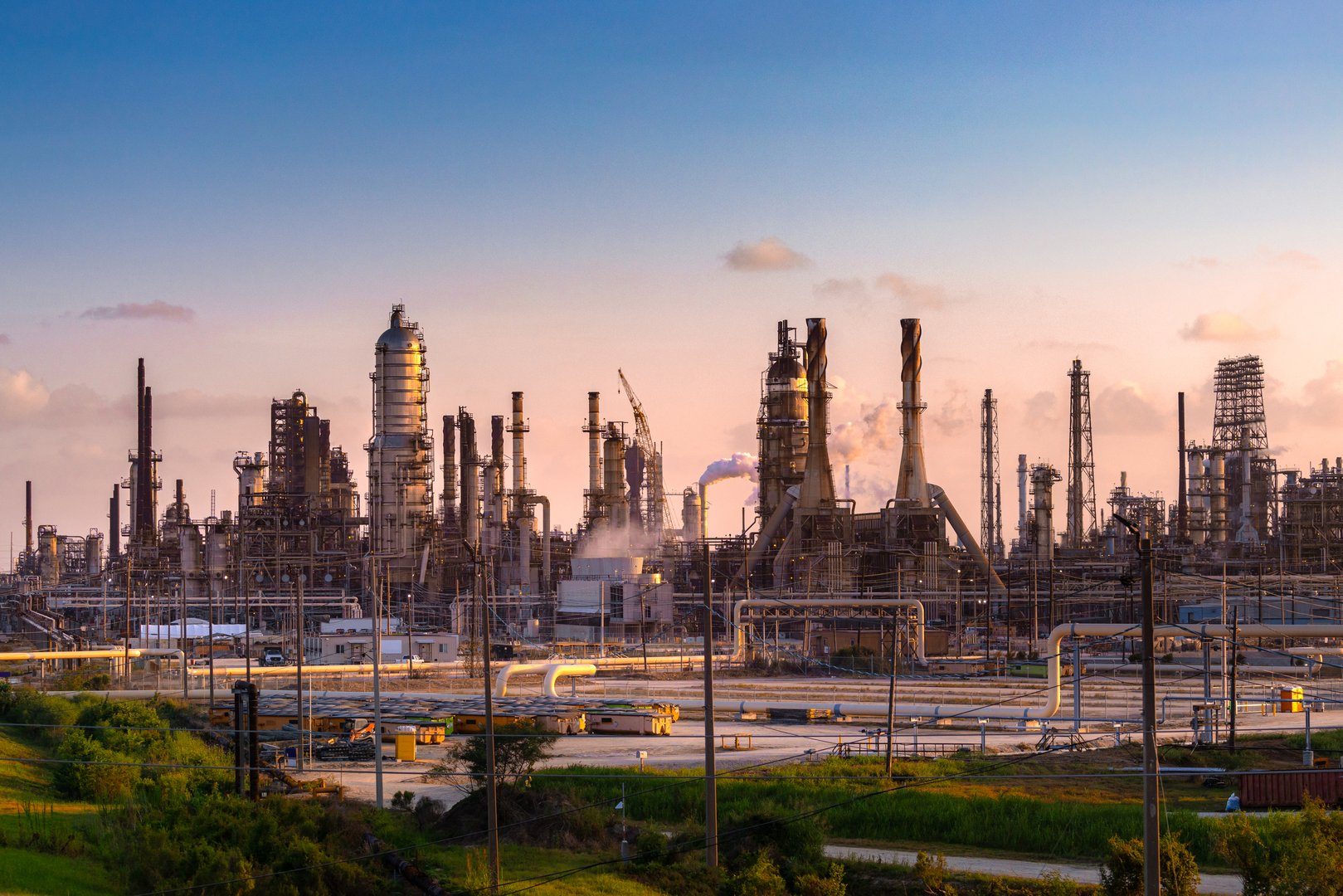 smoke from stack steam and flare emission to environment from refinery petroleum, petrochemical and chemical plant in industrial zone, oil and gas chemical and power energy technology business