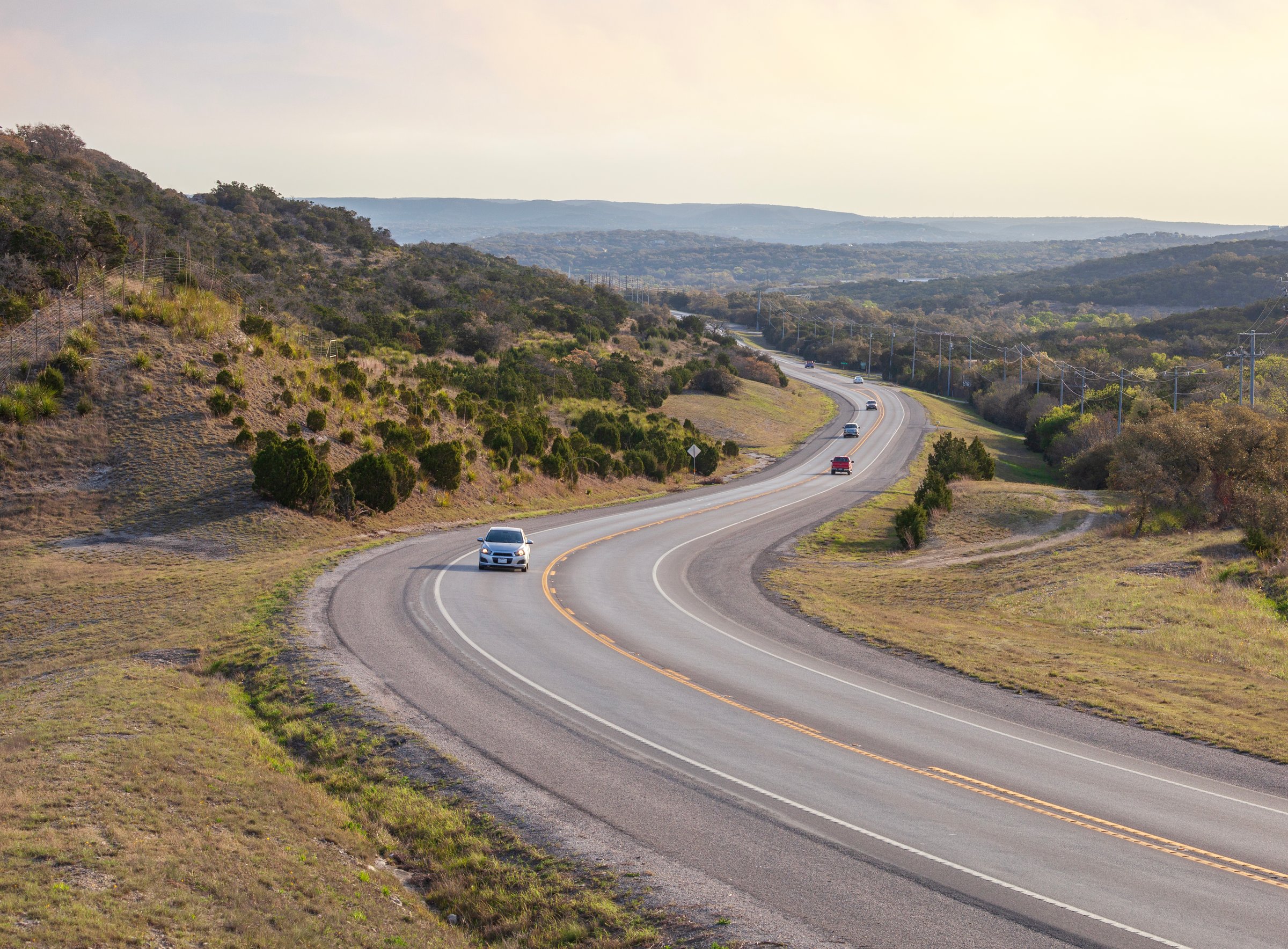 Curving road in the Texas Hill Country on a bright spring morning