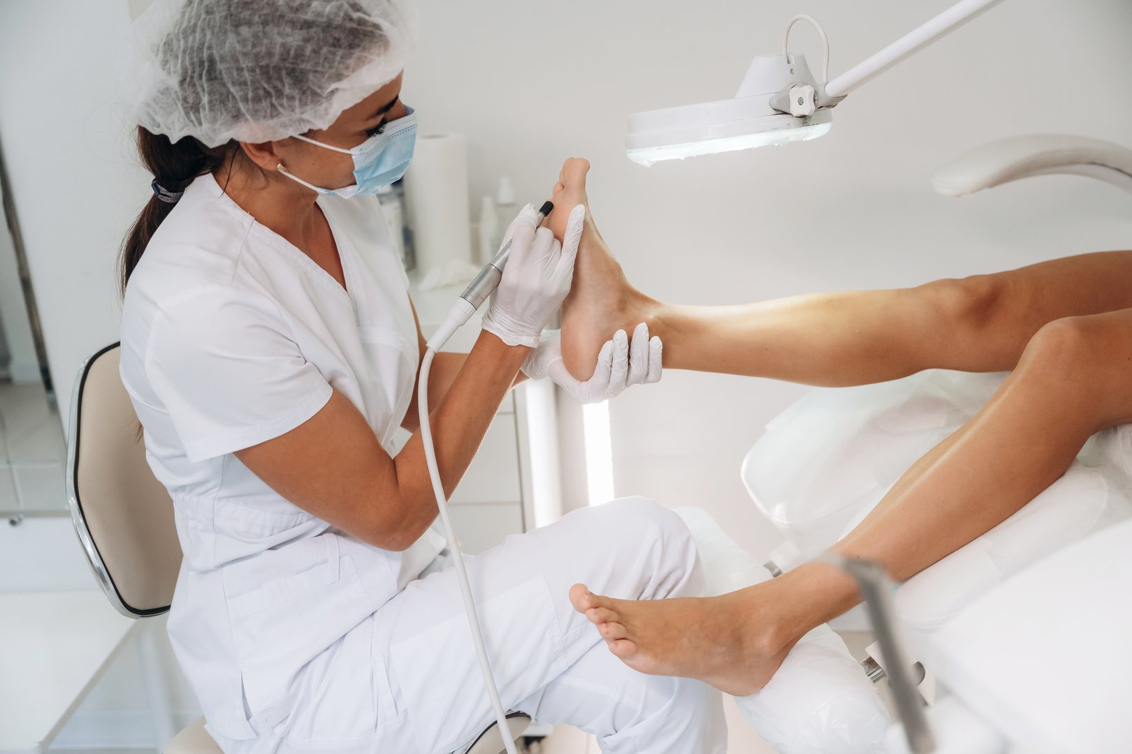 Podiatrist treating client