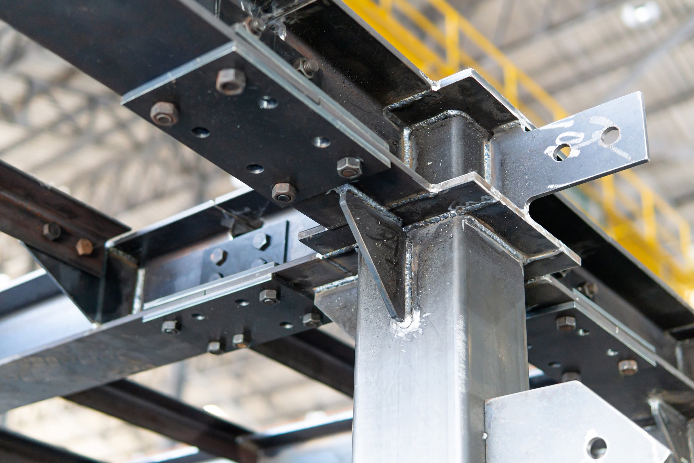 Close up welding beads joint on structure construction work in factory