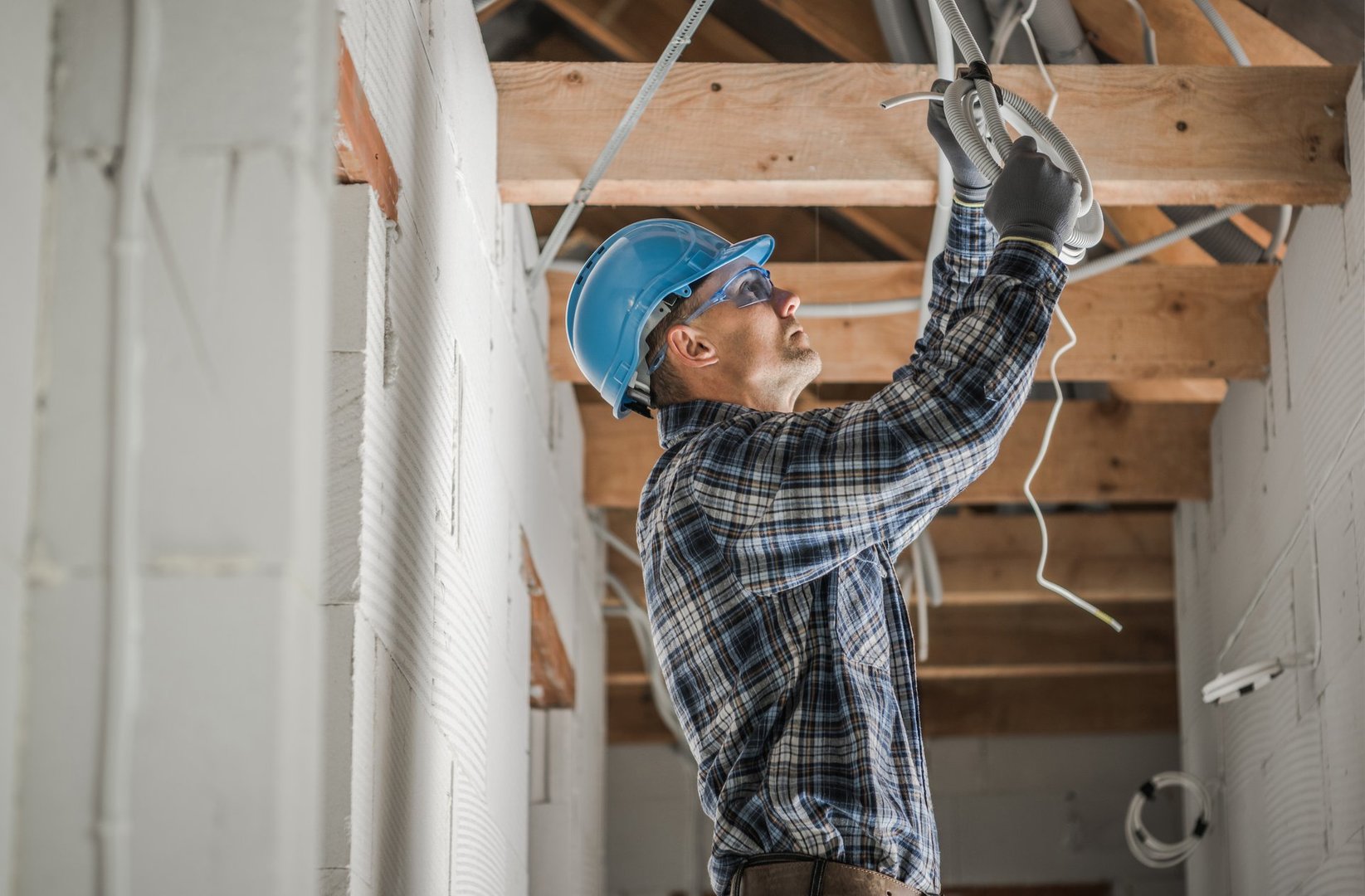 Experienced electricians conducting maintenance and repair