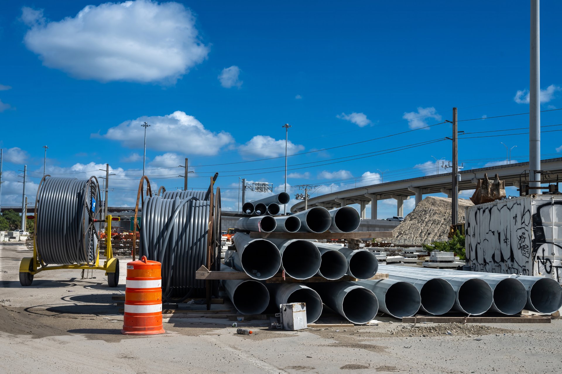 Pipes, poles and cables at expressway expansion site