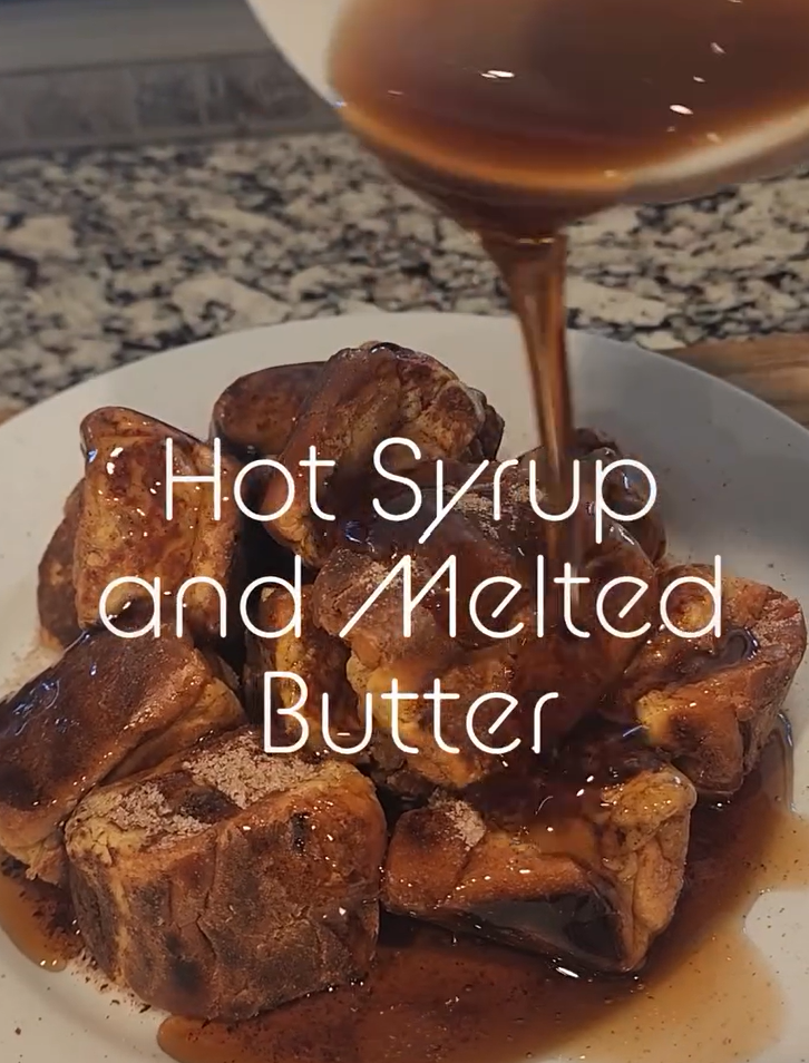 Drizzling warm maple butter over French toast bites
