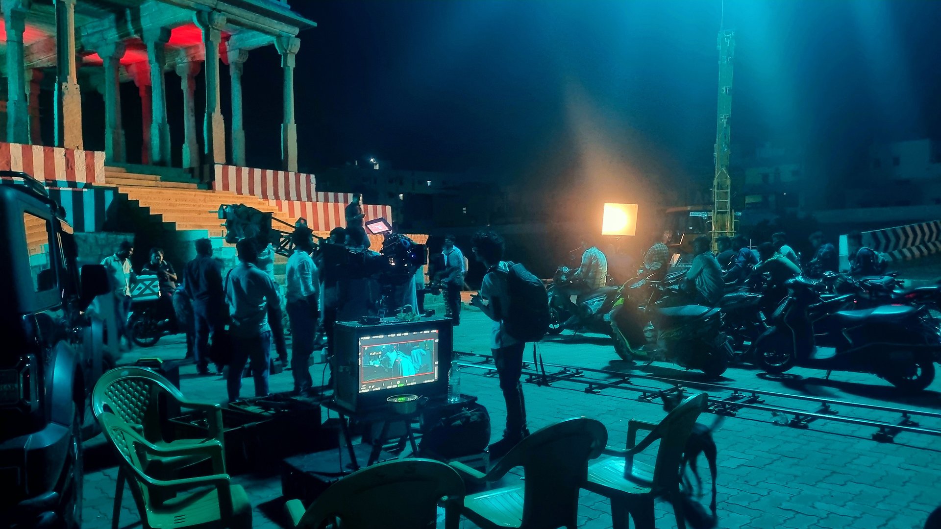 Professional film production set with cinema camera and crew